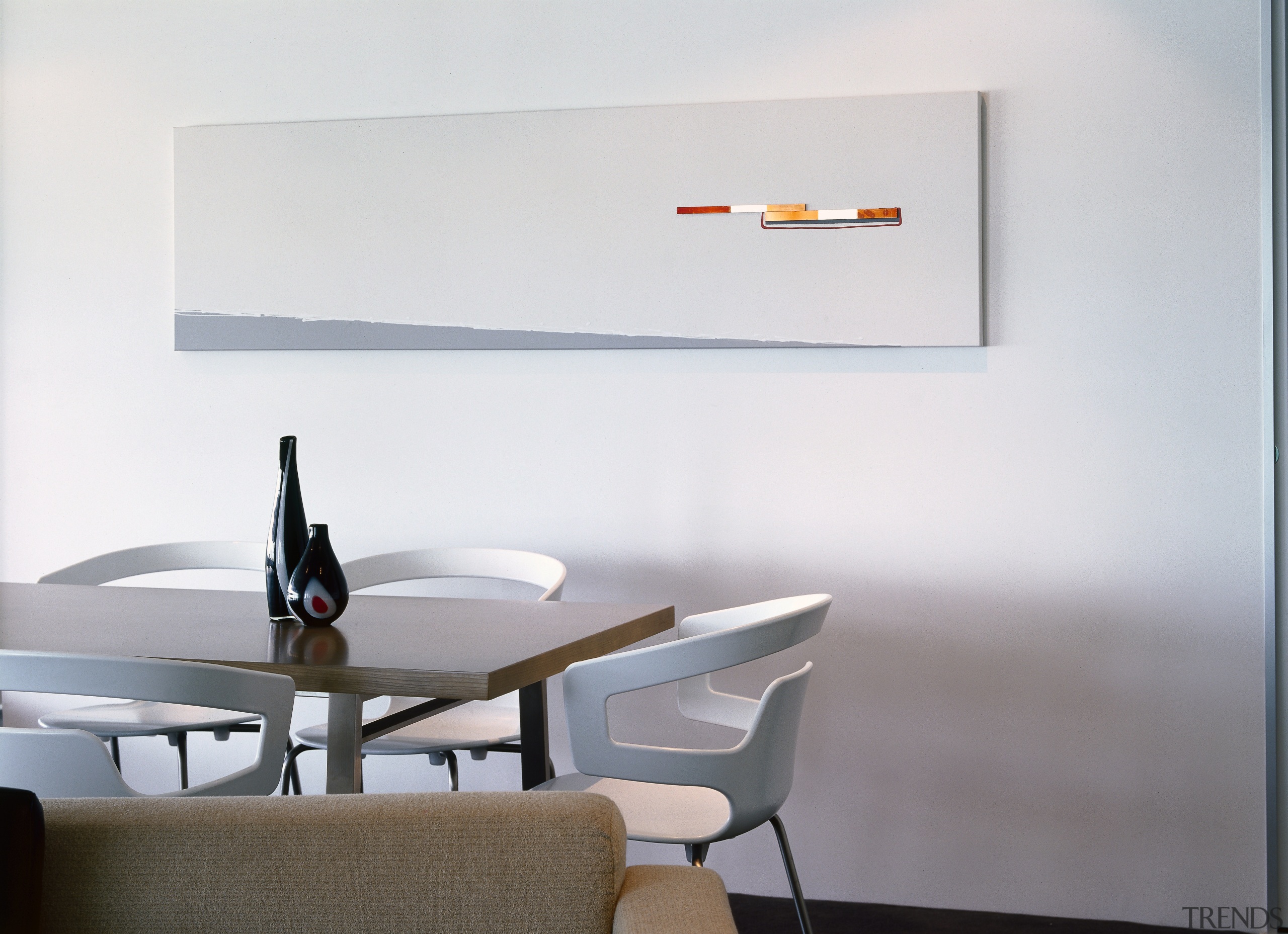 Dining area with white walls and long artwork furniture, interior design, light fixture, lighting, product design, shelf, table, wall, white