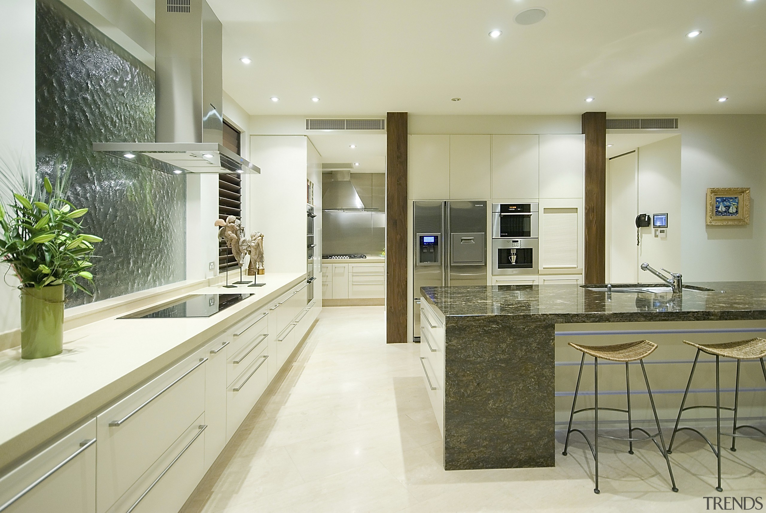 View of the kitchen area which features an cabinetry, countertop, interior design, kitchen, real estate, room, yellow