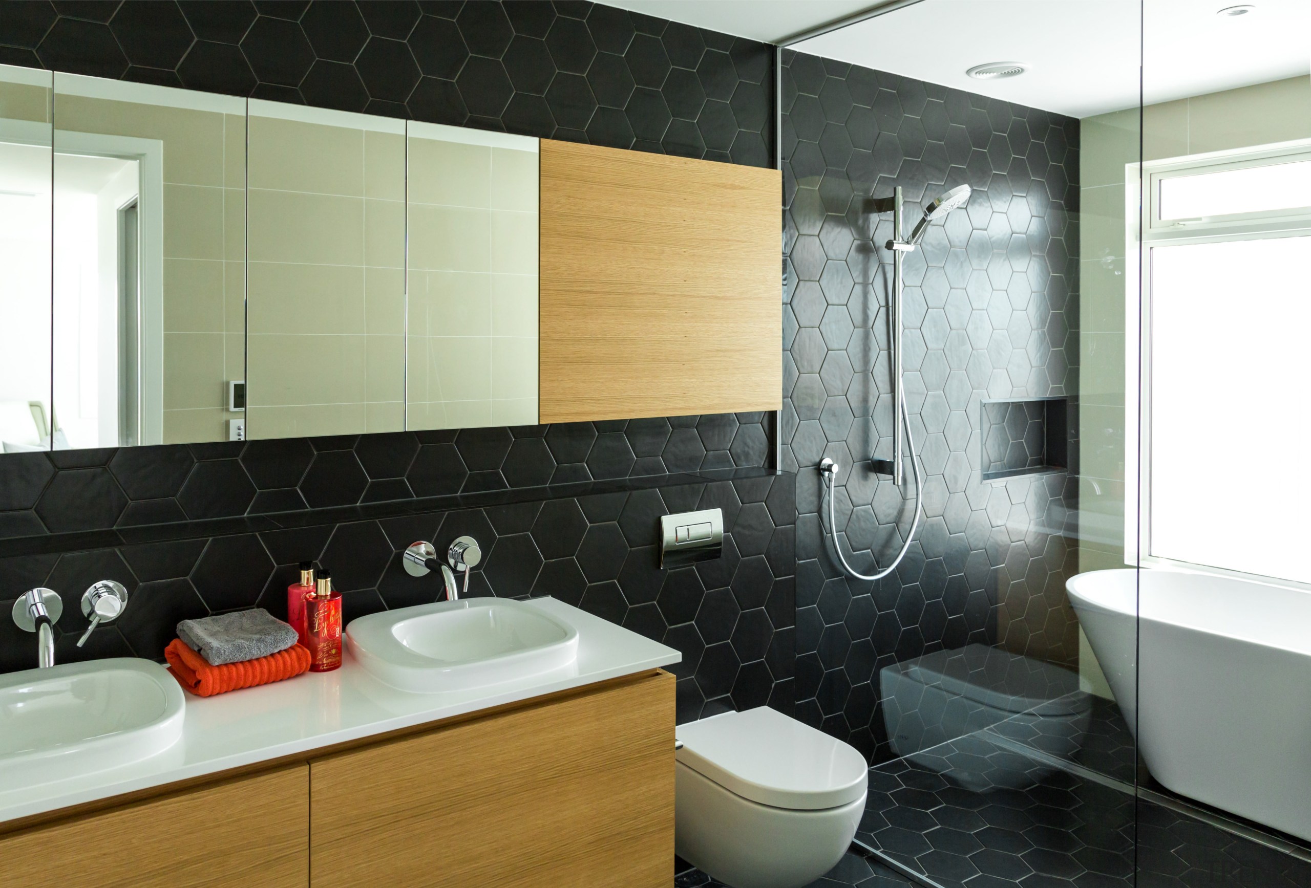 One of five bathrooms in Devonport home renovation bathroom, floor, home, interior design, product design, property, room, sink, tile, wall, black, white