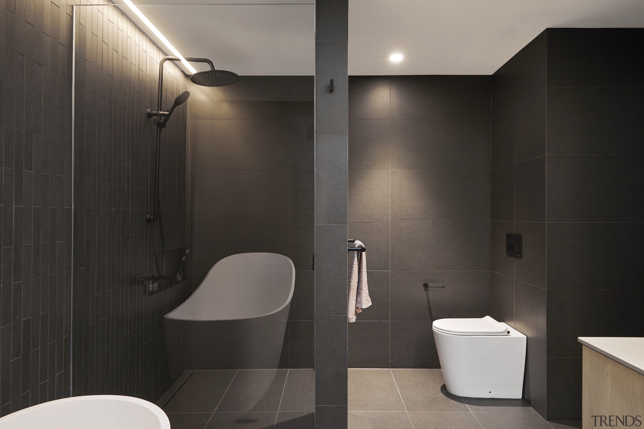 The glass panelling between the shower and bath space 