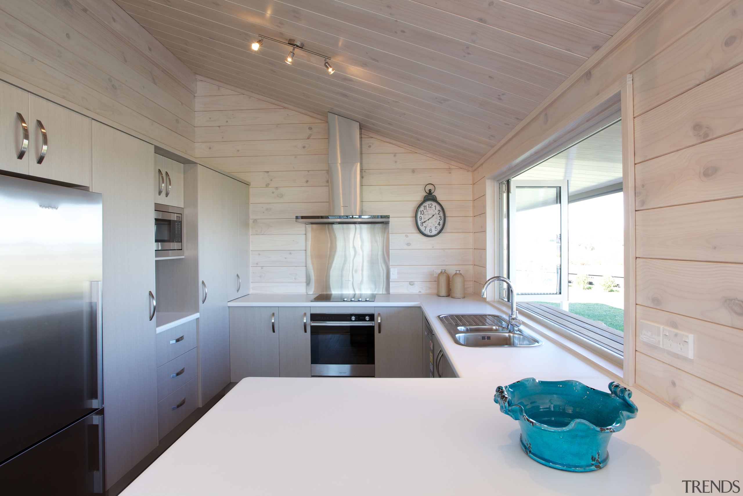 Light-filled white kitchen in new Lockwood home The architecture, ceiling, countertop, daylighting, home, house, interior design, kitchen, real estate, room, gray