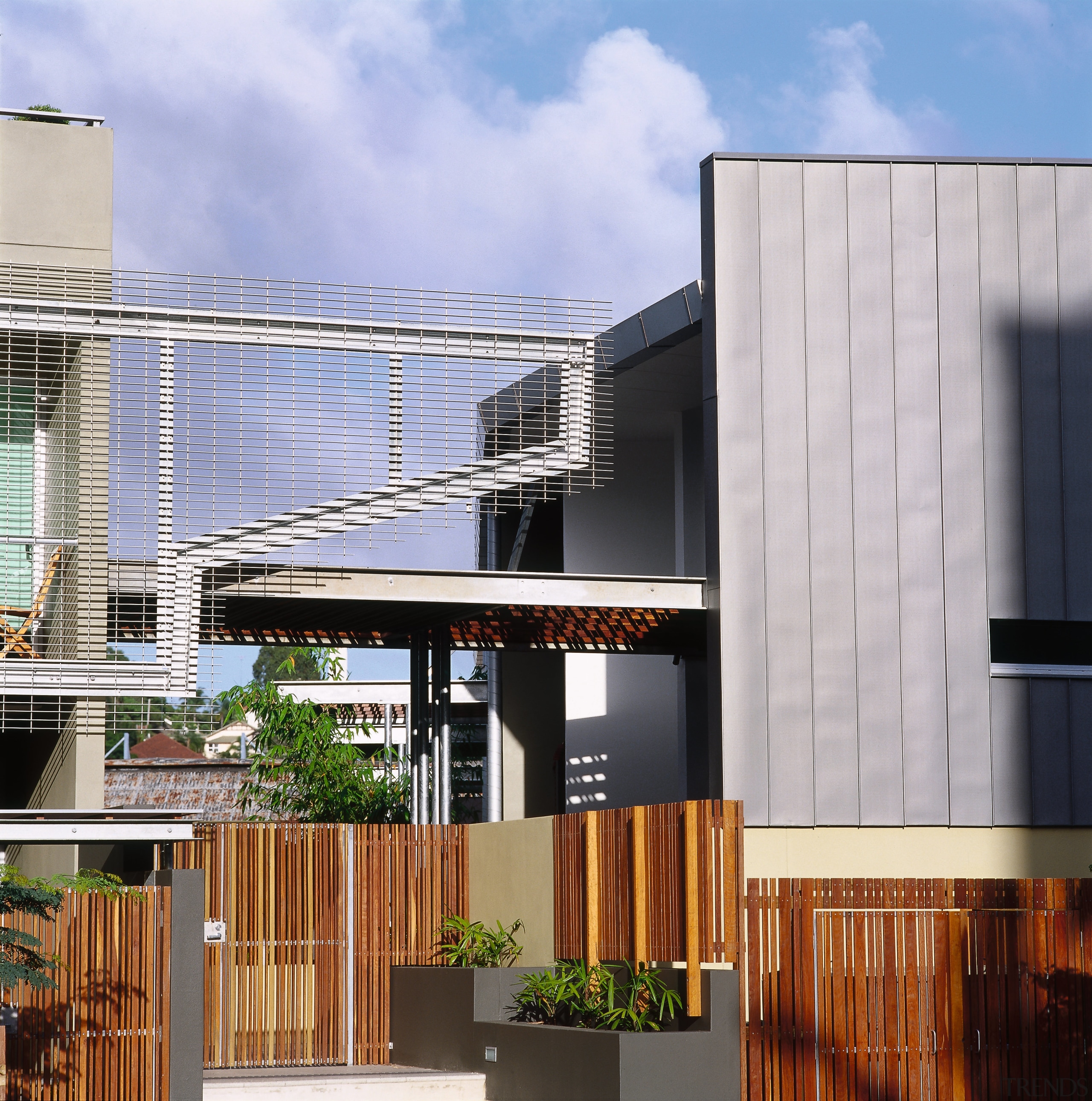 view of the entrance to the apartment block architecture, building, condominium, elevation, facade, home, house, property, real estate, residential area, teal