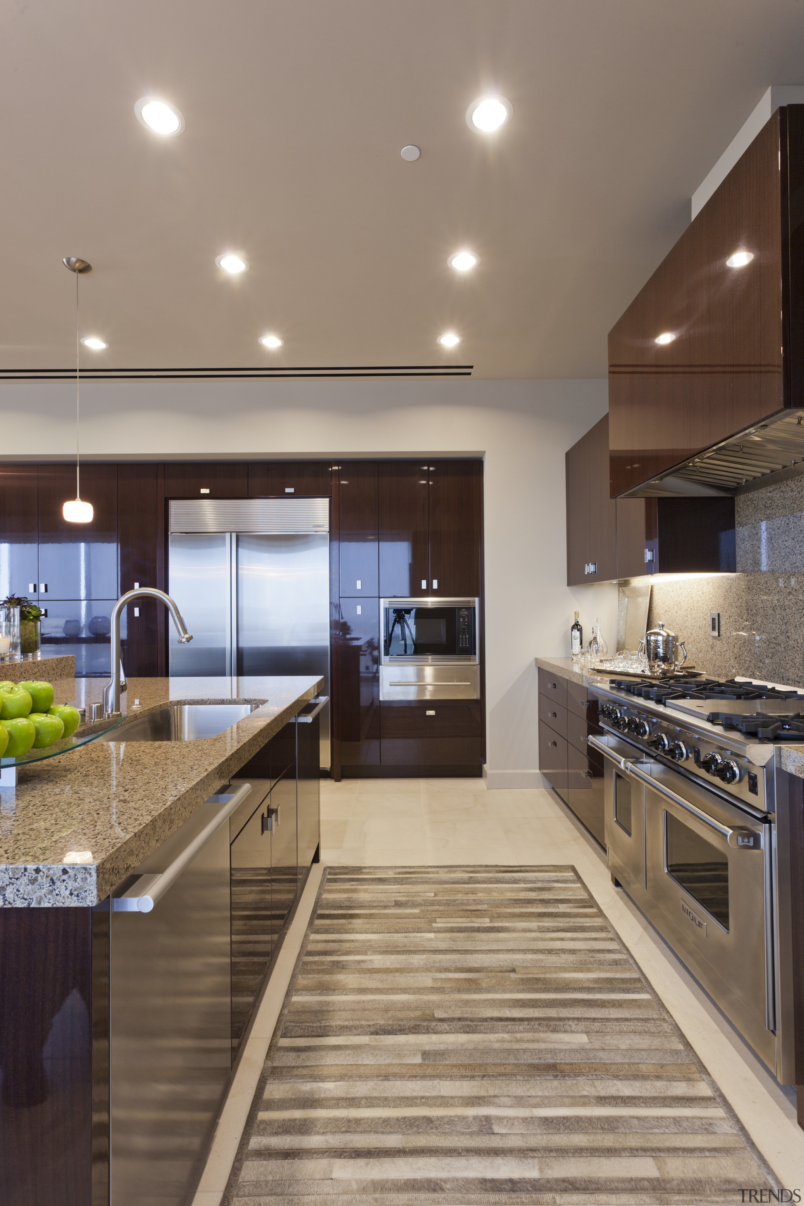 View of contemporary kitchen with dark toned cabinets. cabinetry, ceiling, countertop, interior design, kitchen, real estate, gray, brown