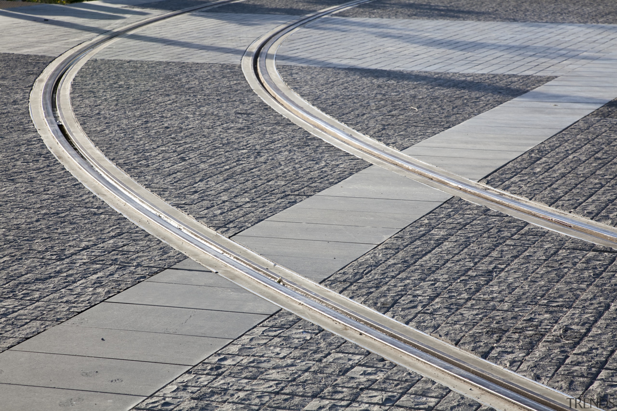 Tram tracks in Wynyard Quarter, Auckland - Tram asphalt, fixed link, infrastructure, lane, line, road, road surface, track, gray