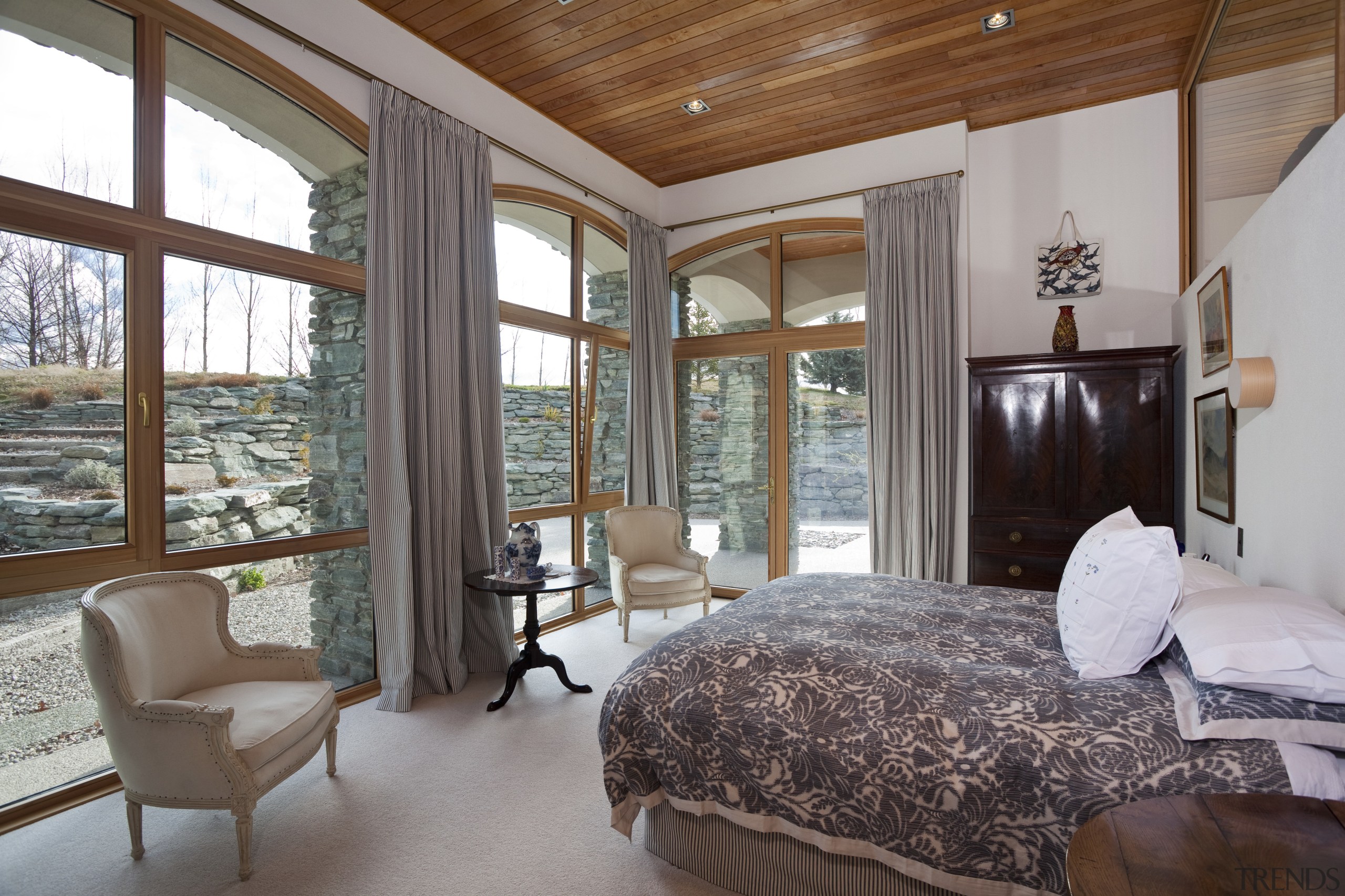 Bedroom with light toned flooring and walls, wooden bedroom, ceiling, estate, interior design, property, real estate, room, window, wood, gray