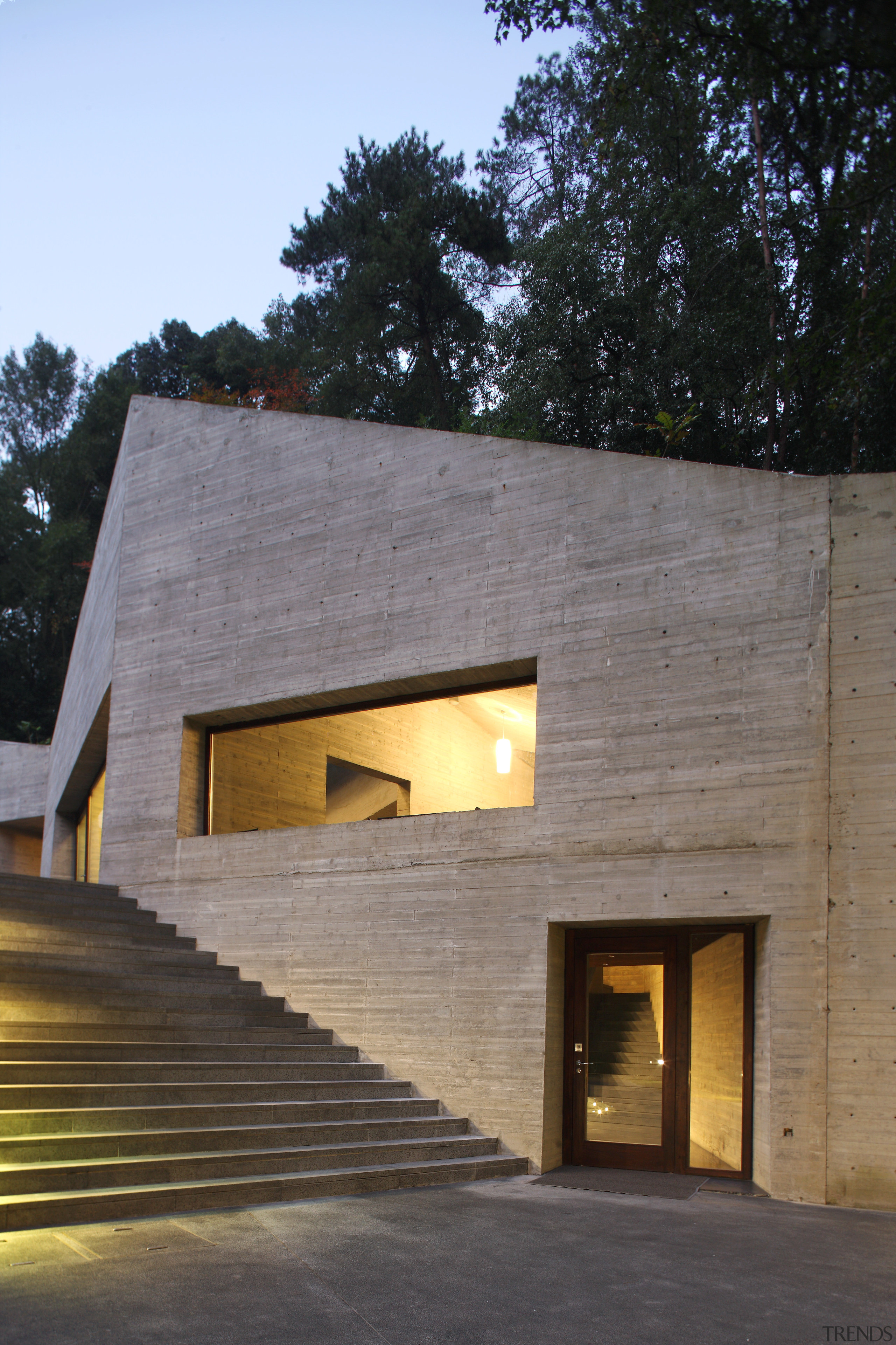 Exterior view of the clubhouse which features volcanic architecture, building, facade, home, house, siding, gray, black