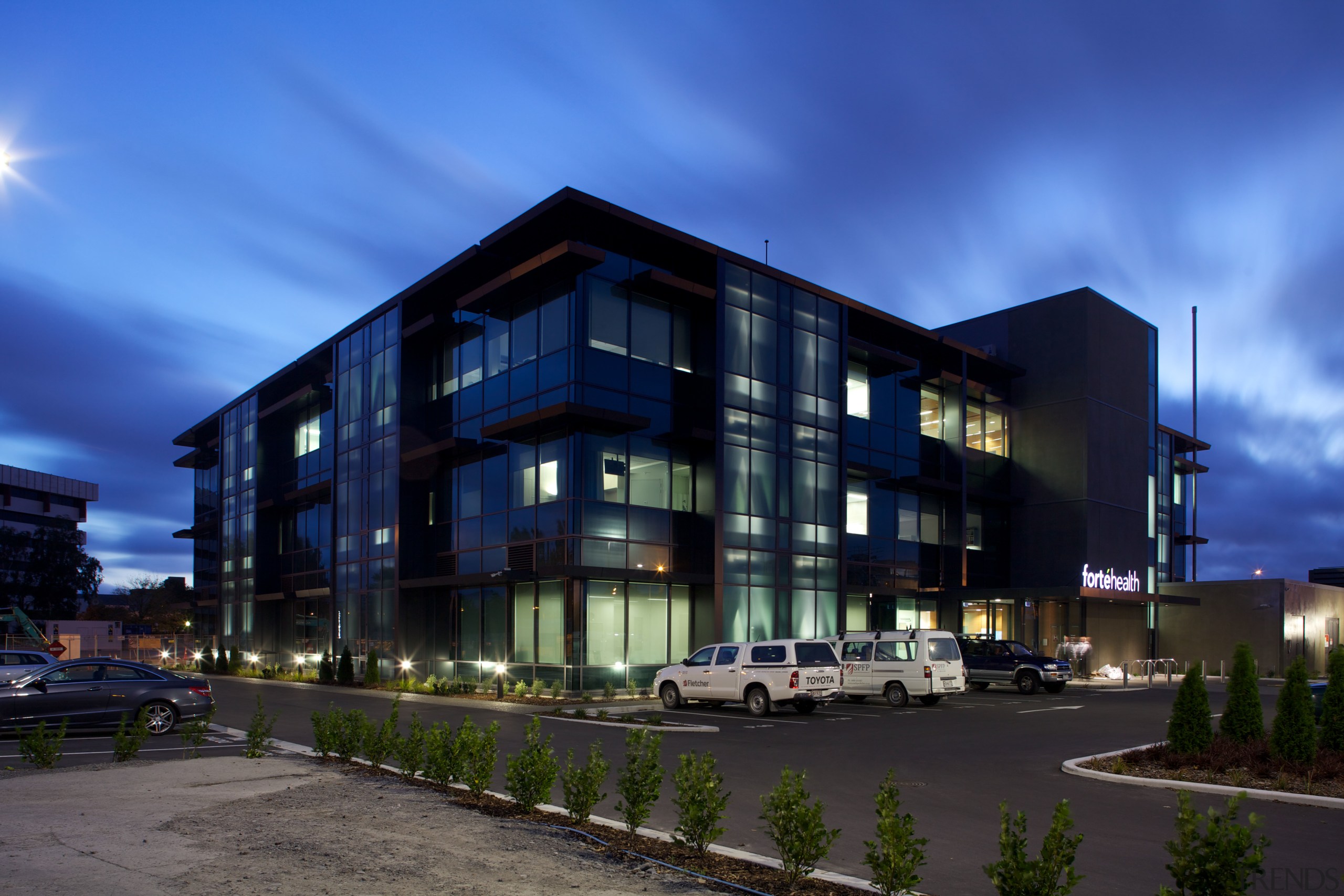 Advanced seismic damping ensures the Forté Health building apartment, architecture, building, commercial building, condominium, corporate headquarters, evening, facade, headquarters, home, house, metropolitan area, mixed use, property, real estate, residential area, sky, blue, black