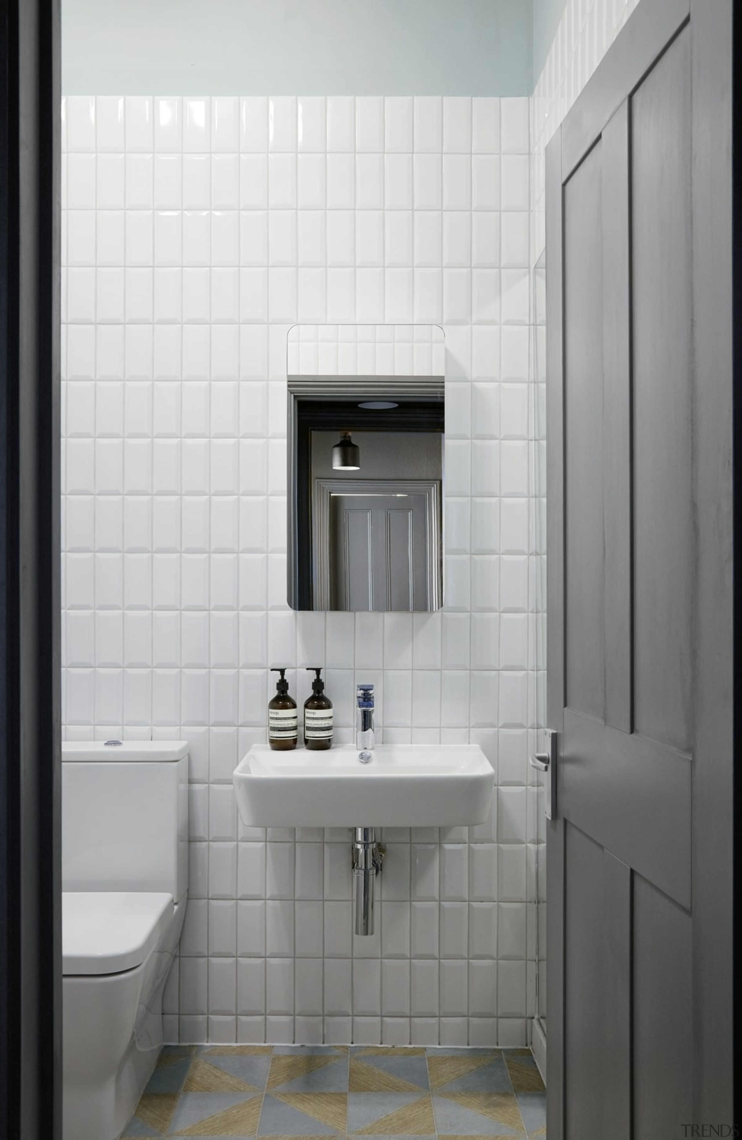 White tiles keep the bathroom feeling open - bathroom, bathroom accessory, bathroom cabinet, floor, interior design, plumbing fixture, product design, room, sink, tile, gray