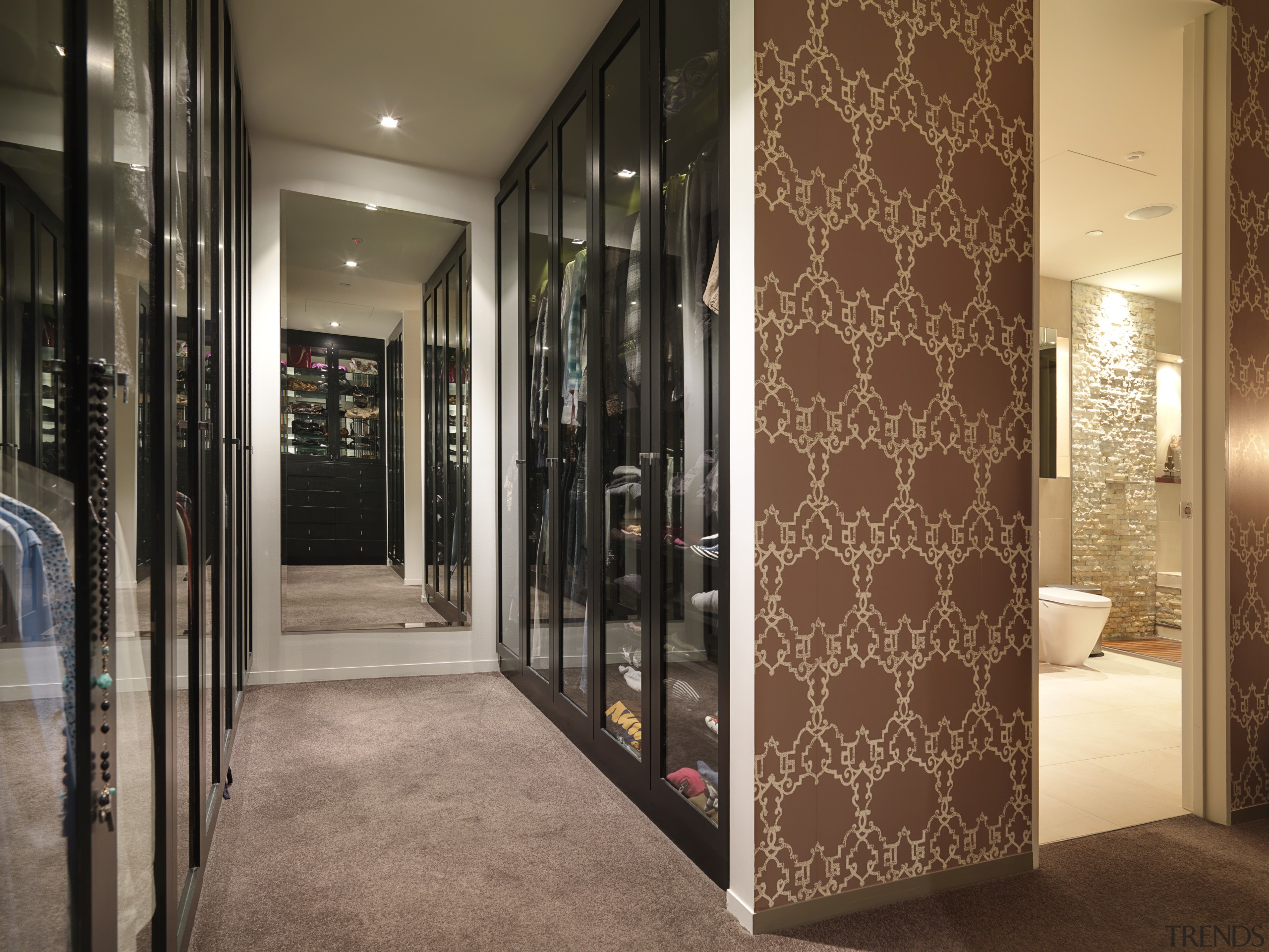 View of the closet space in the master door, flooring, interior design, lobby, room, wall, brown