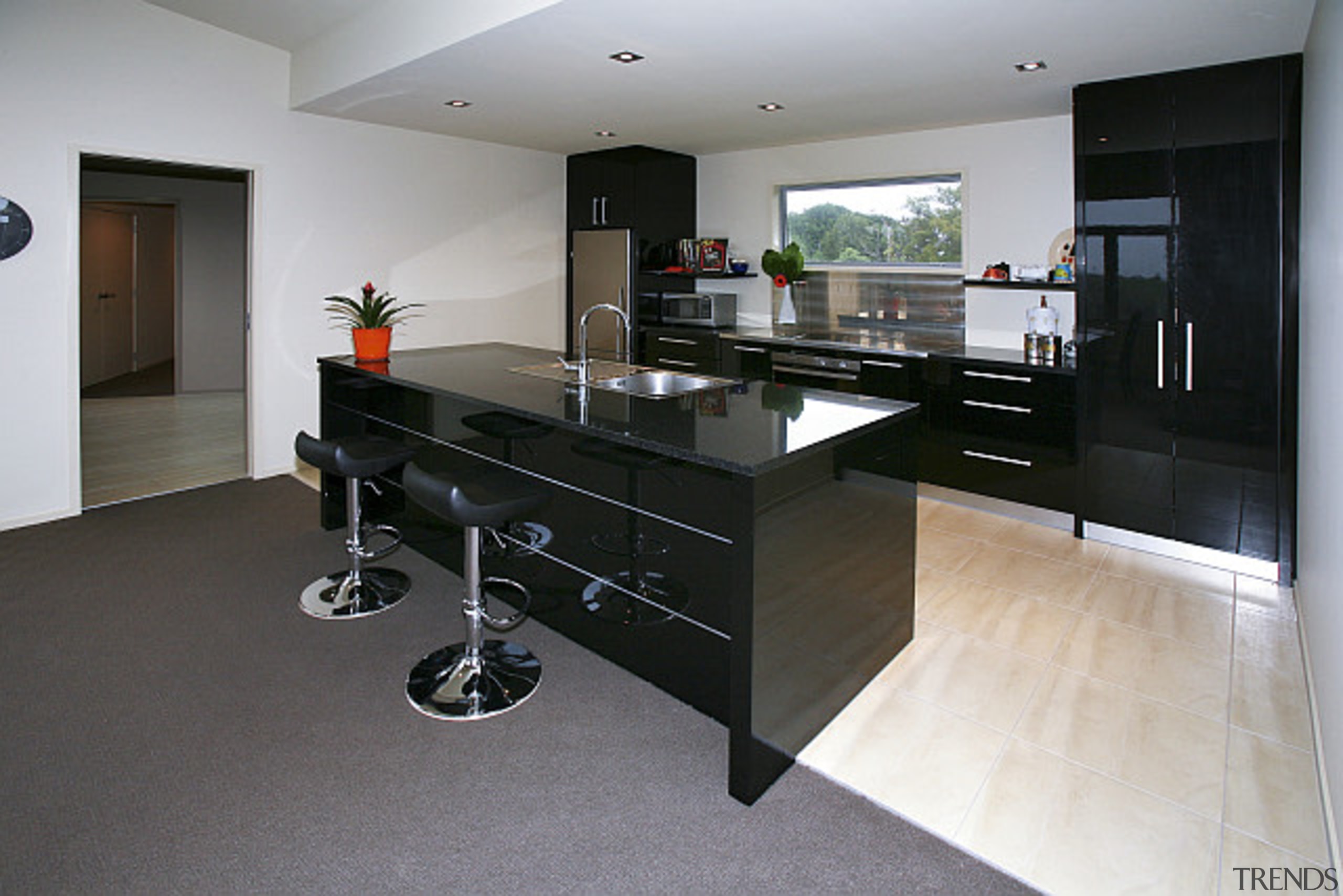 Black lacquered kitchen features in this home built countertop, floor, flooring, interior design, kitchen, property, room, gray, black