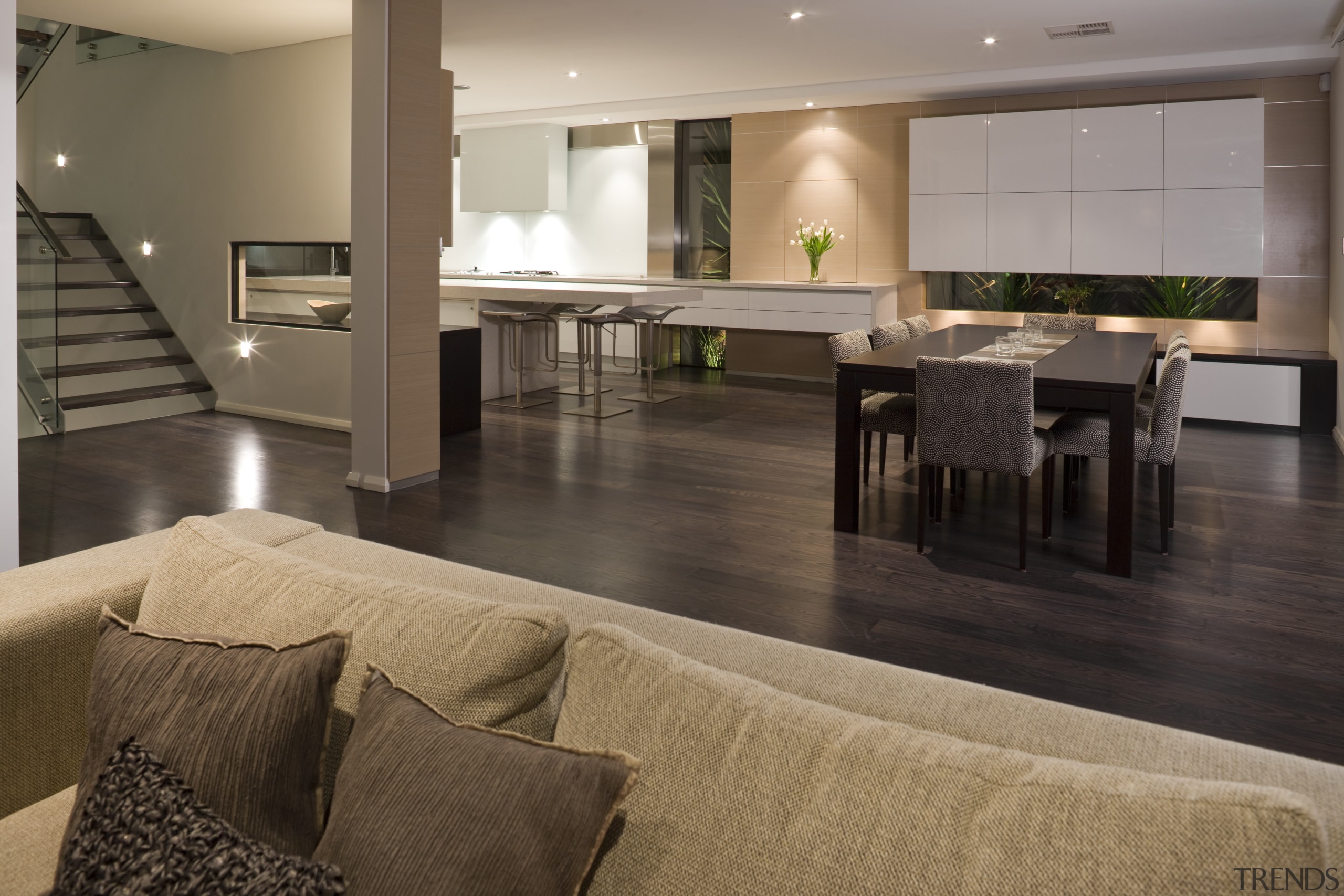 In this kitchen, designed by Loen House, the floor, flooring, hardwood, interior design, laminate flooring, living room, lobby, real estate, table, wood, wood flooring, brown