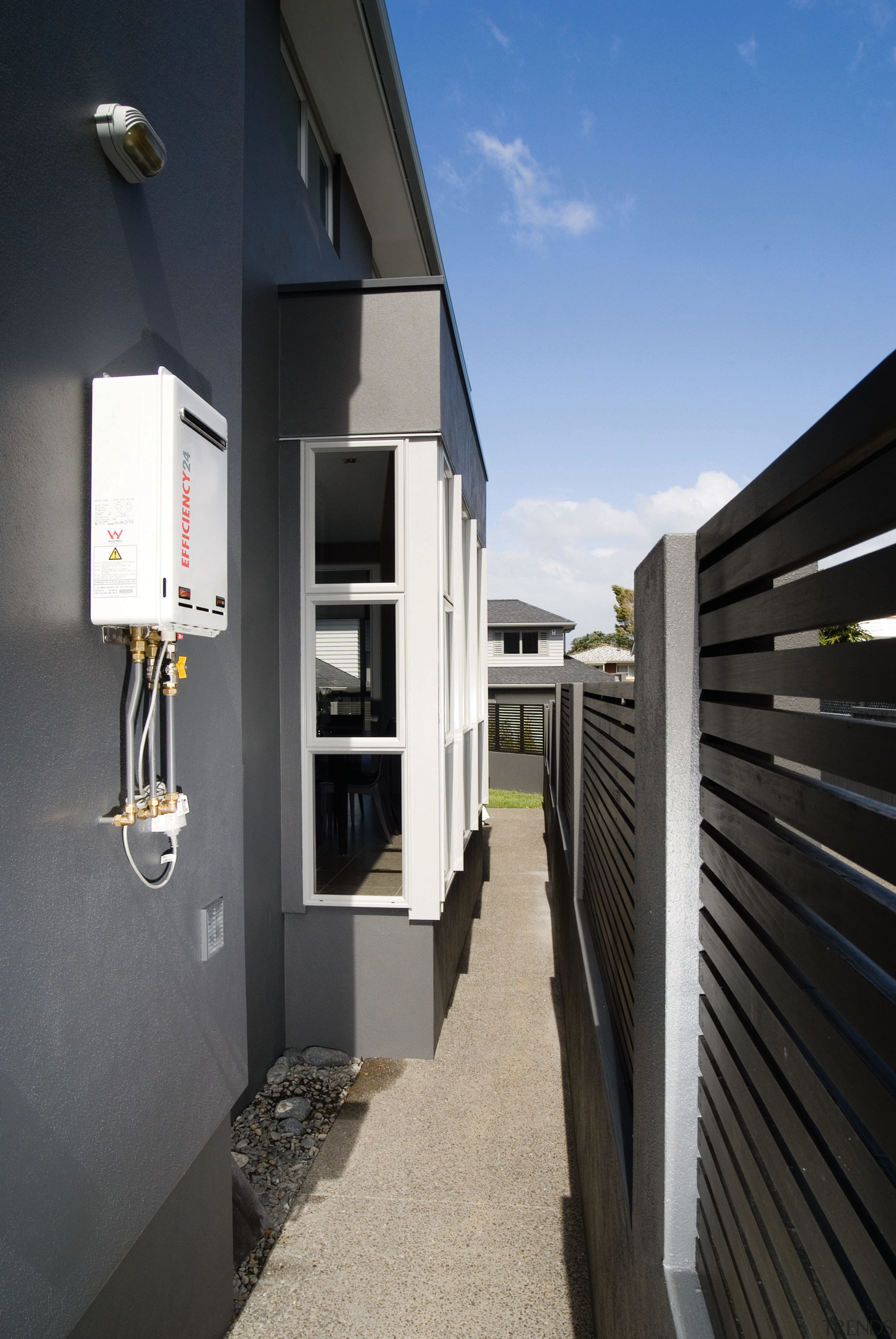 A view of a hot water system by architecture, building, house, property, real estate, black, gray