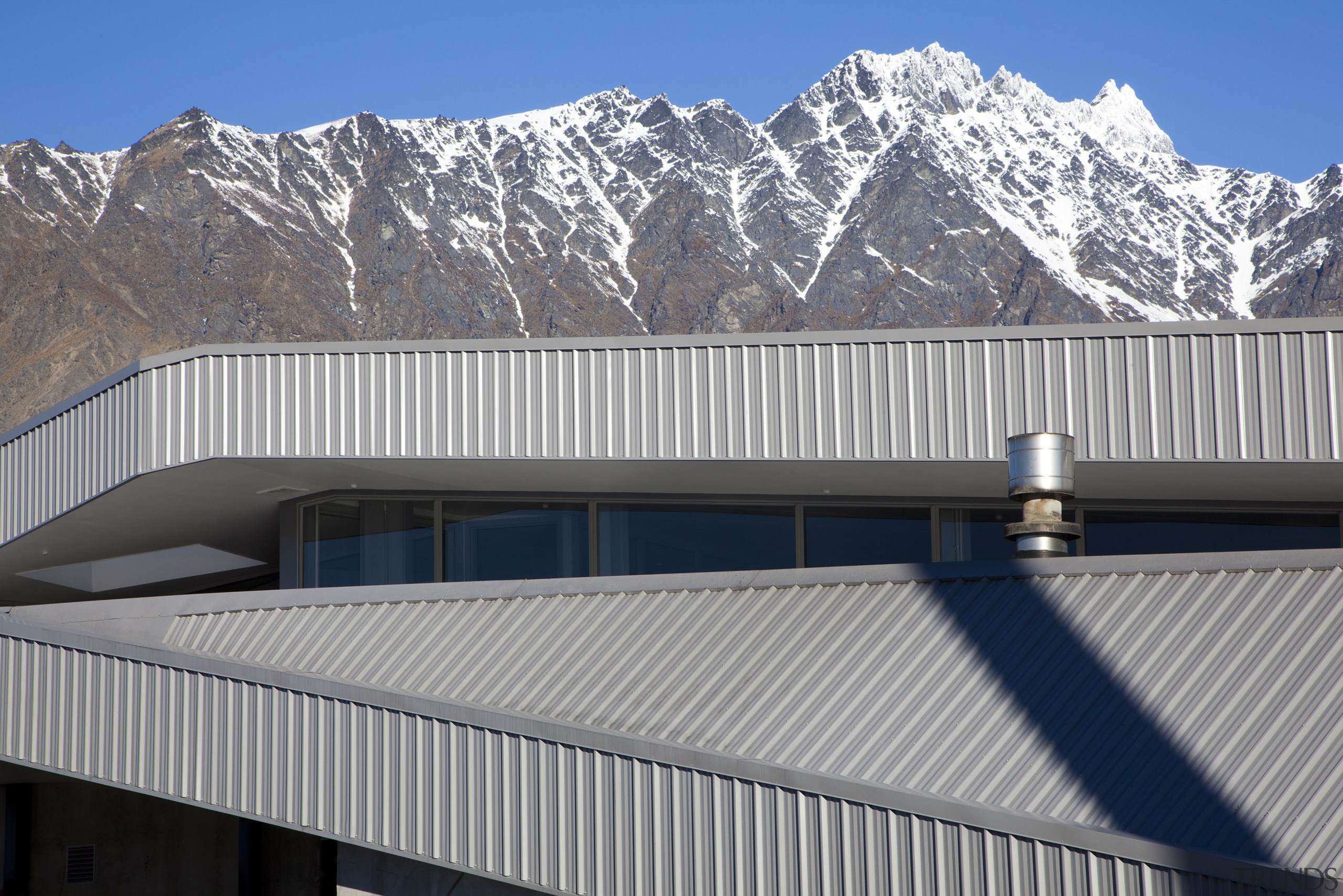 Fabricators Ellisons Aluminium combined products from Aluminium Systems alps, architecture, building, daylighting, elevation, facade, house, mountain, mountain range, real estate, roof, sky, snow, structure, winter, gray