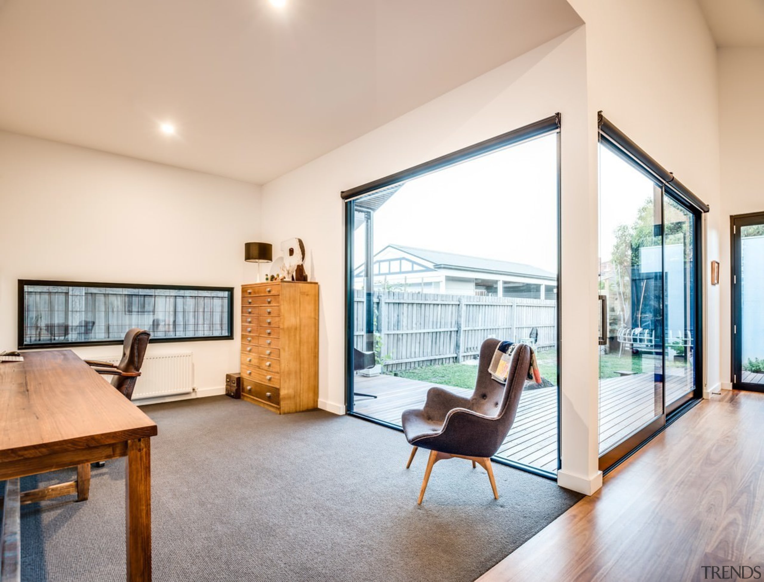 This study area opens out onto the deck architecture, ceiling, daylighting, estate, floor, flooring, home, house, interior design, living room, property, real estate, room, window, white