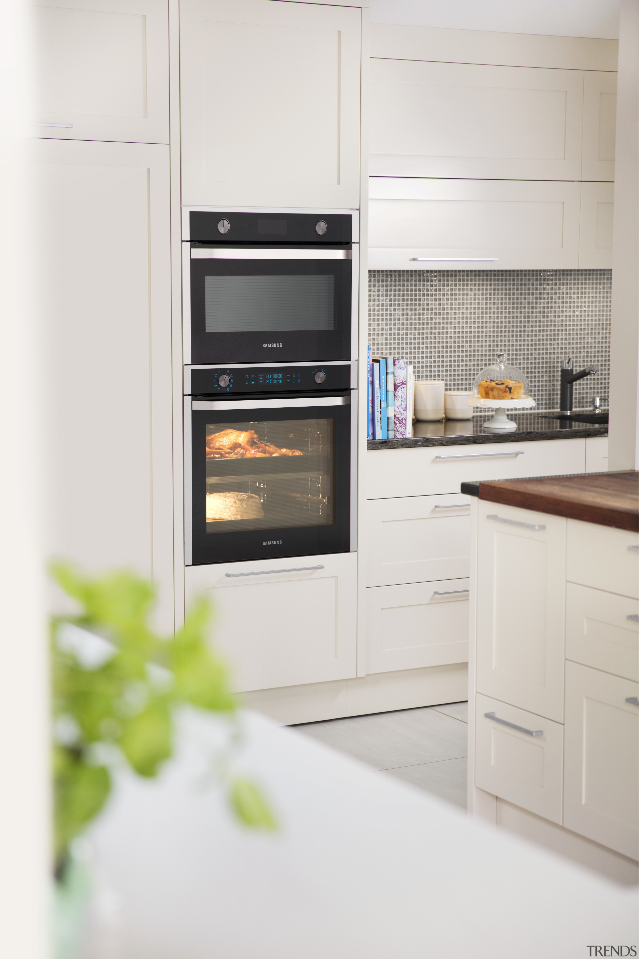 The Samsung 75-litre Dual Cook oven includes a countertop, home appliance, kitchen, kitchen appliance, kitchen stove, major appliance, microwave oven, oven, refrigerator, white