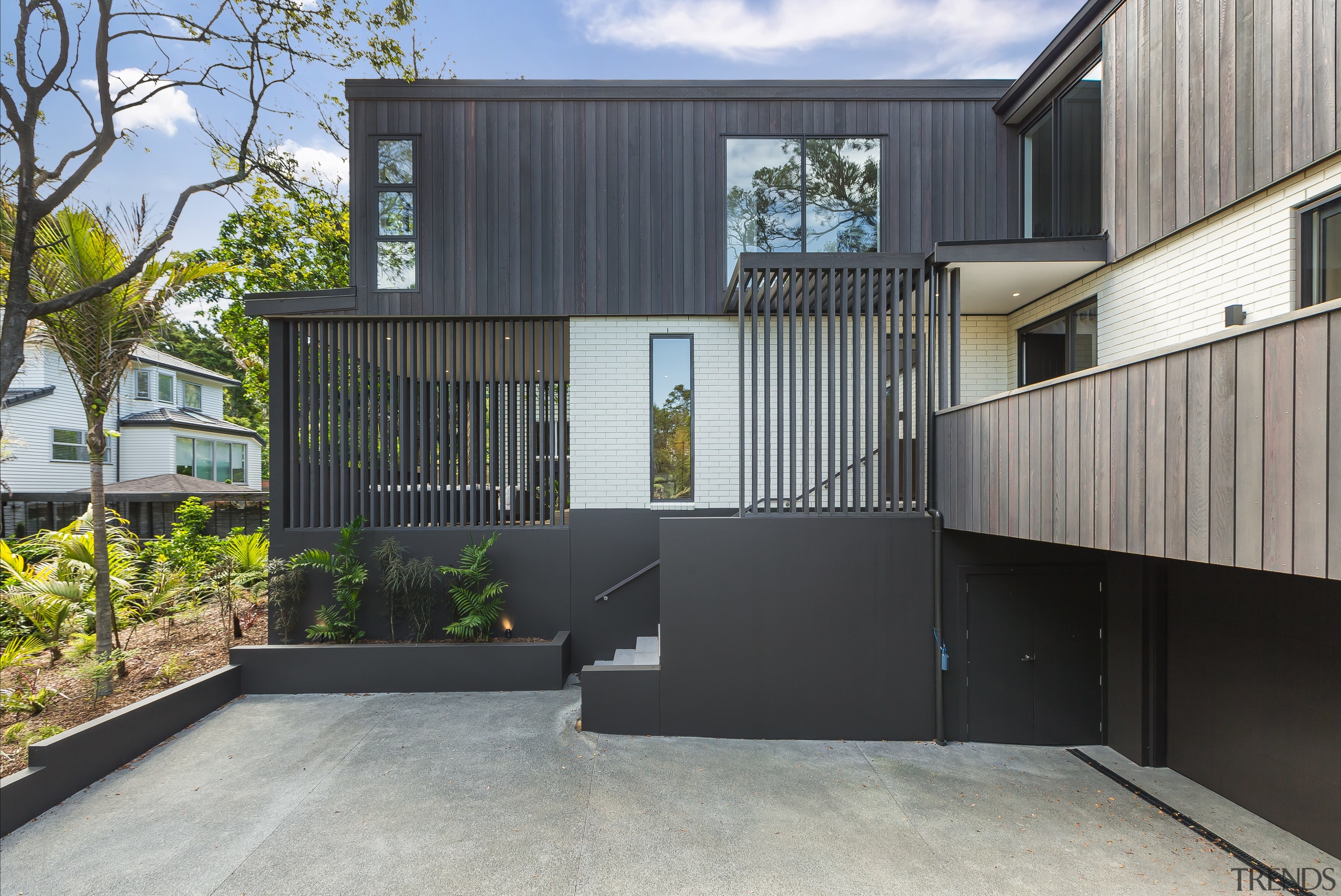 Soft grey vertical cedar contrasts with a light 