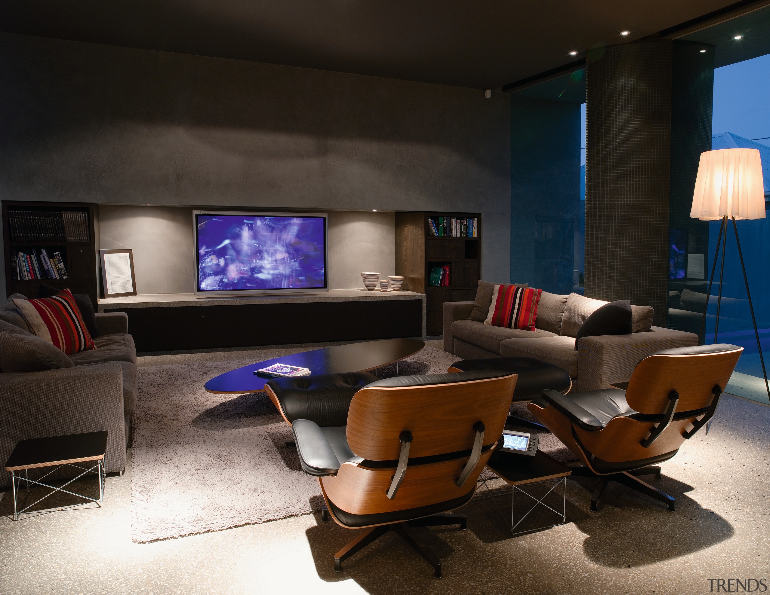 A view of the living area, polished concrete chair, furniture, interior design, living room, room, black
