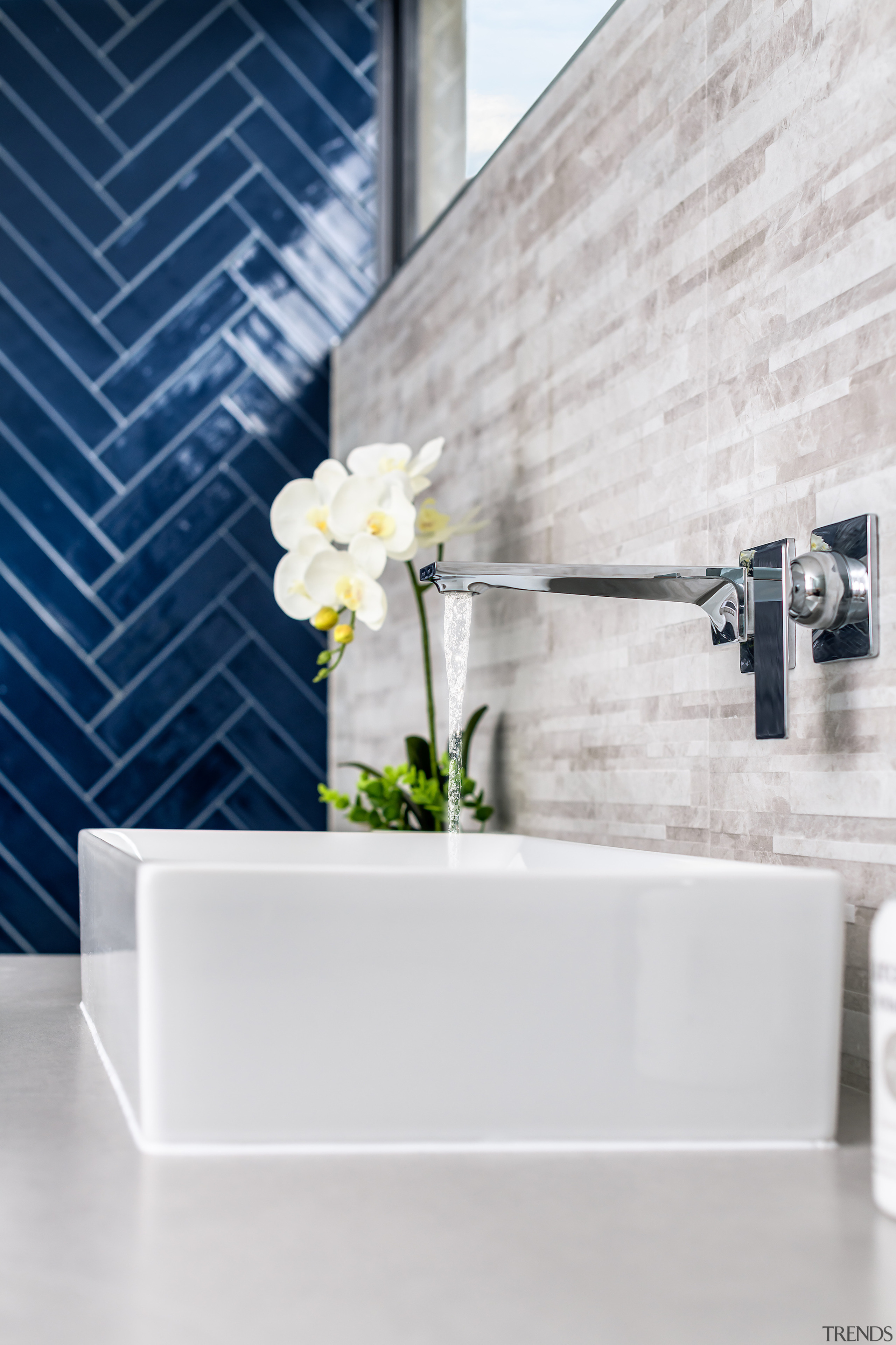 The rectangular tabletop vanity basin strikes a contemporary 