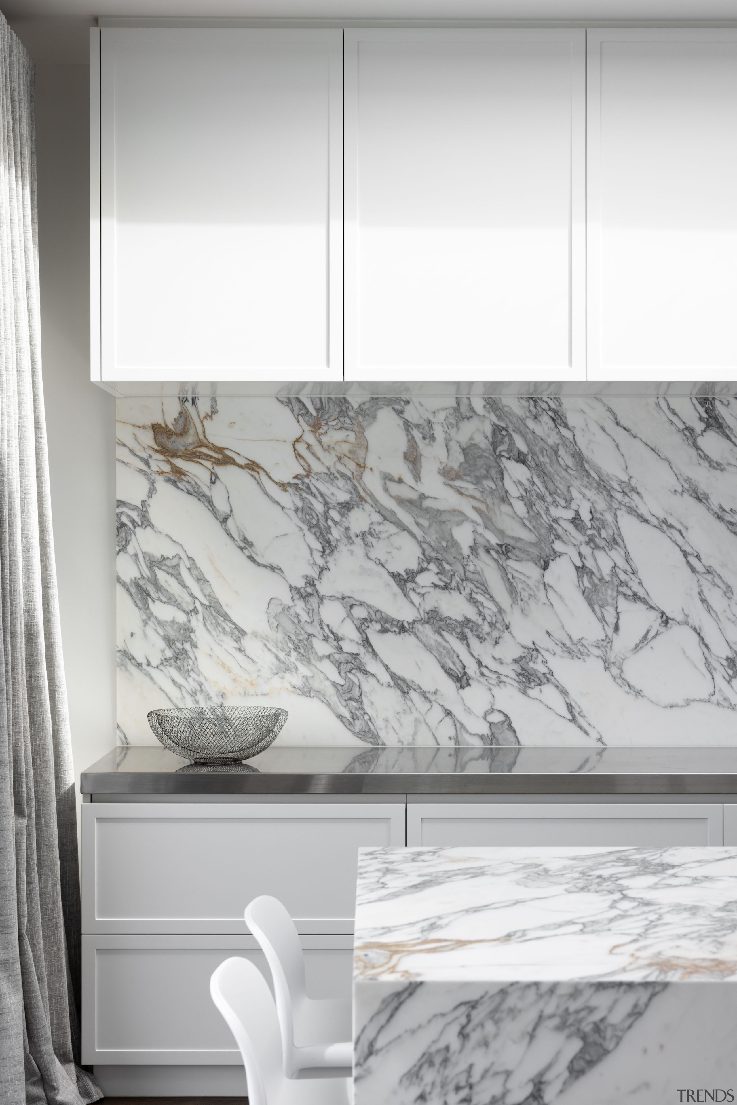 The dark veining in the marble connects with 