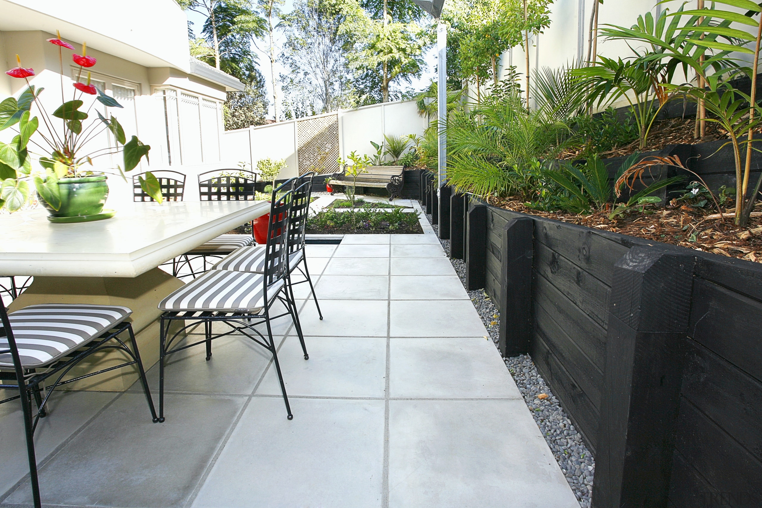 A view of the jagas platinum pavers layed backyard, courtyard, outdoor structure, patio, plant, real estate, yard, white