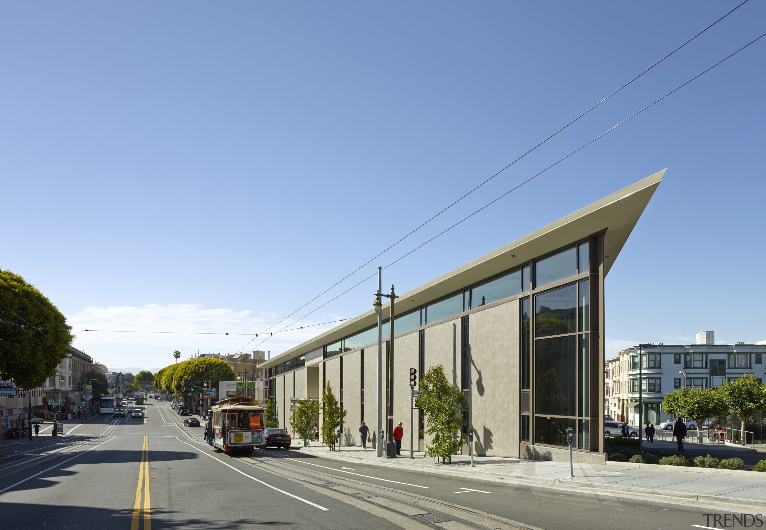 Cable cars travel up Columbus Avenue in San architecture, building, commercial building, condominium, corporate headquarters, house, metropolitan area, mixed use, neighbourhood, real estate, residential area, sky, teal