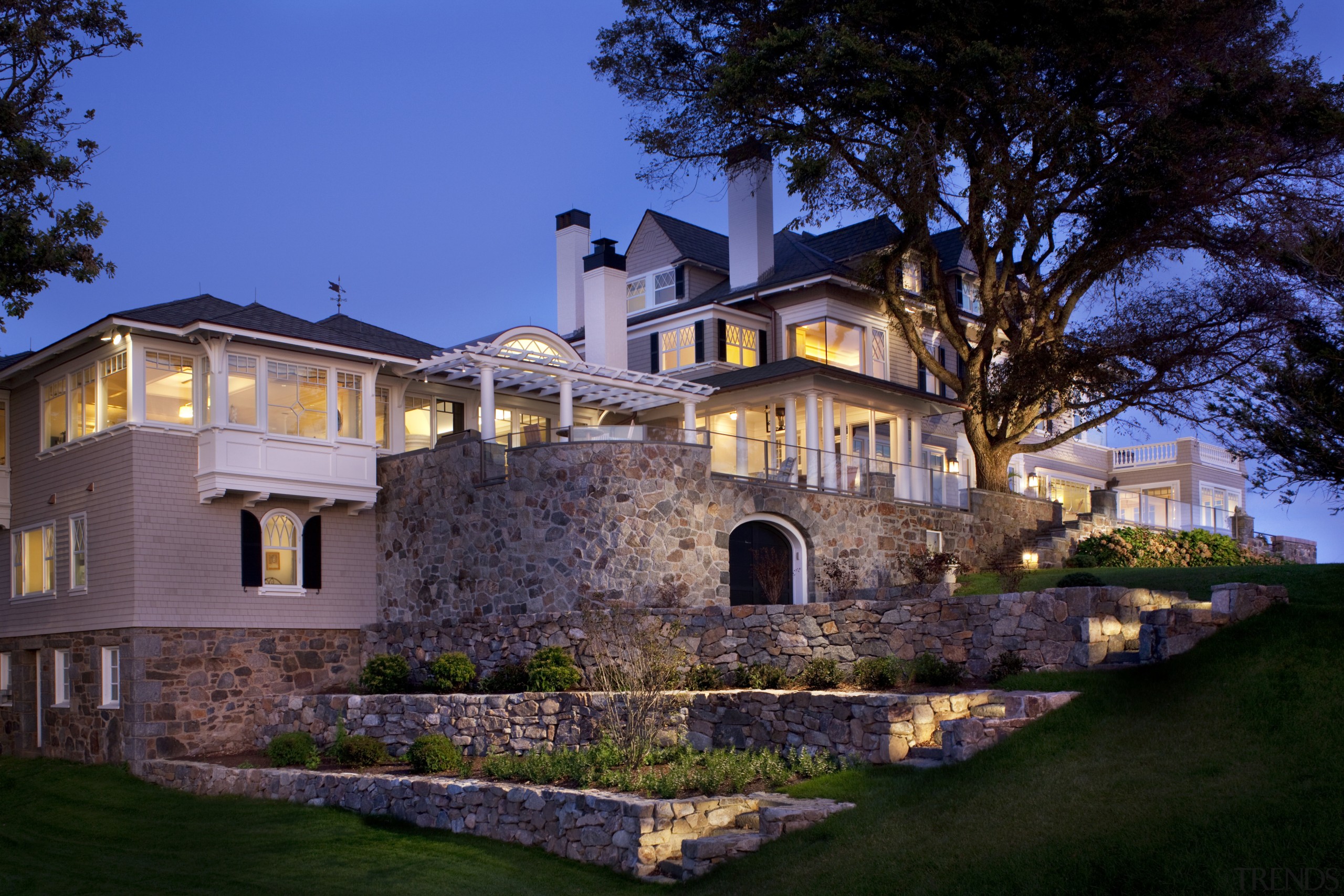 Stonework on this home continues onto the newly architecture, building, cottage, estate, evening, facade, historic house, home, house, landscape lighting, lighting, mansion, property, real estate, residential area, sky, villa, black