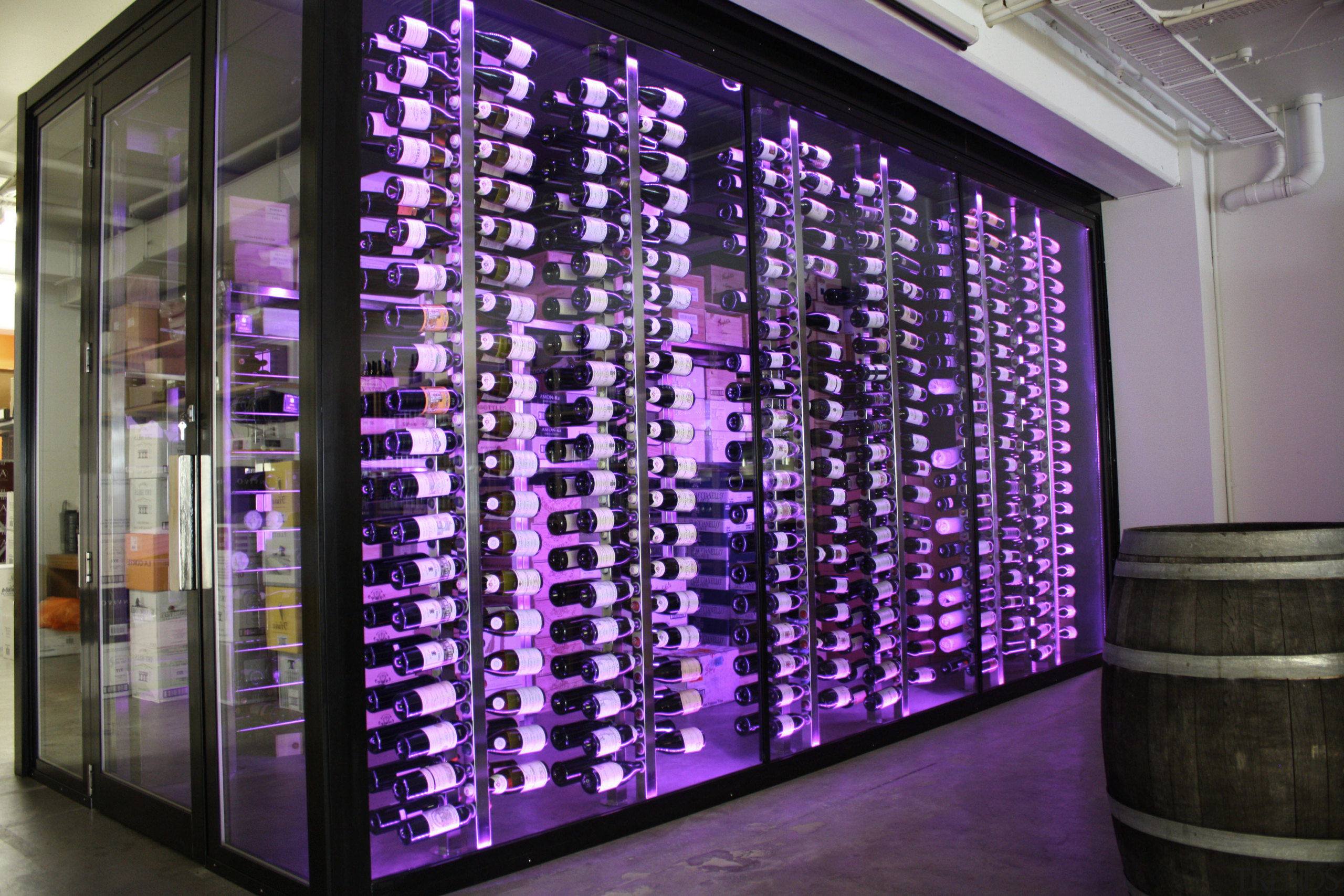 View of refrigeration solution at wine retailer. - display case, display window, glass, interior design, lobby, purple, window, purple