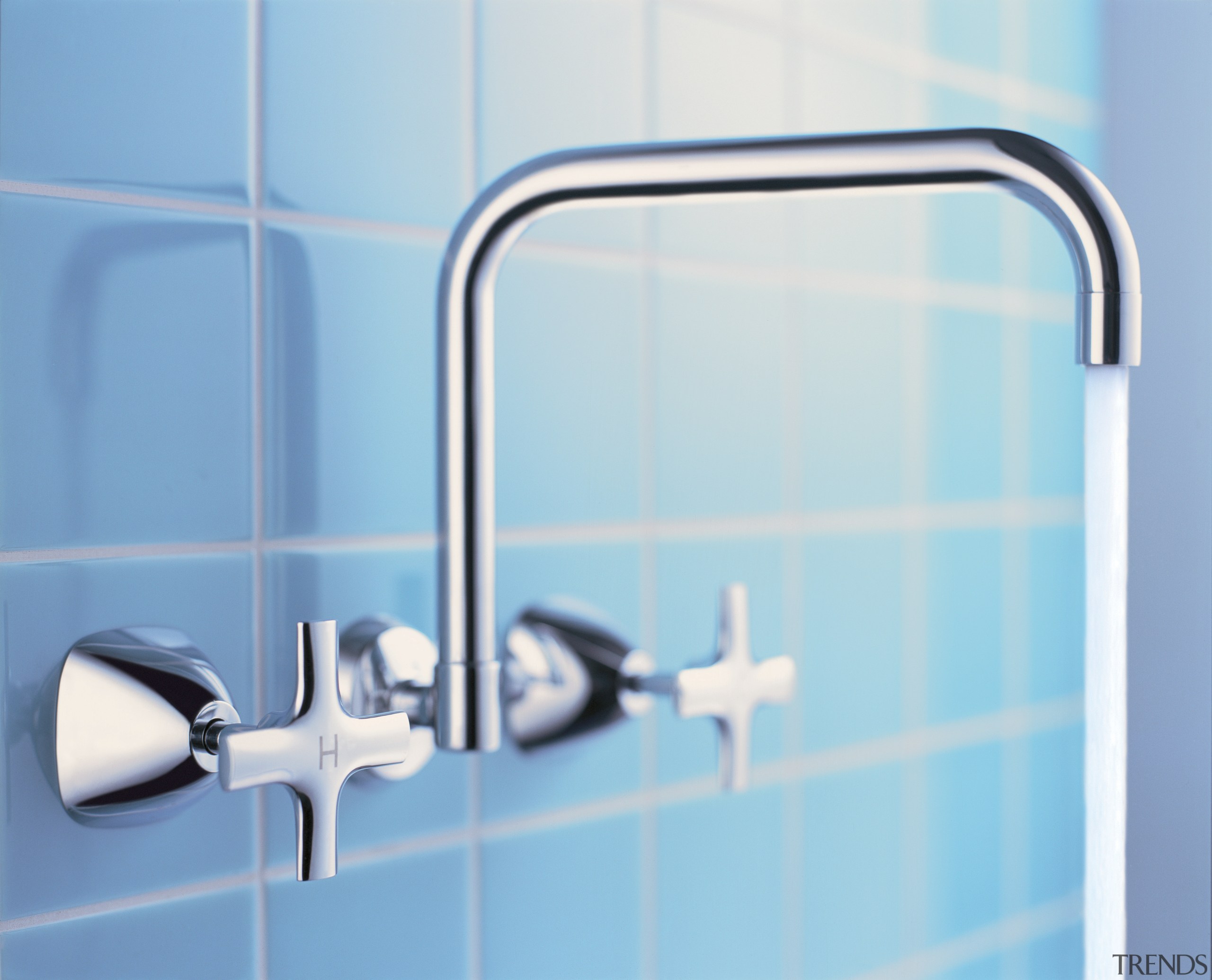 Tapware set into wall with blue tiles behind. blue, line, plumbing fixture, product, product design, tap, teal, white
