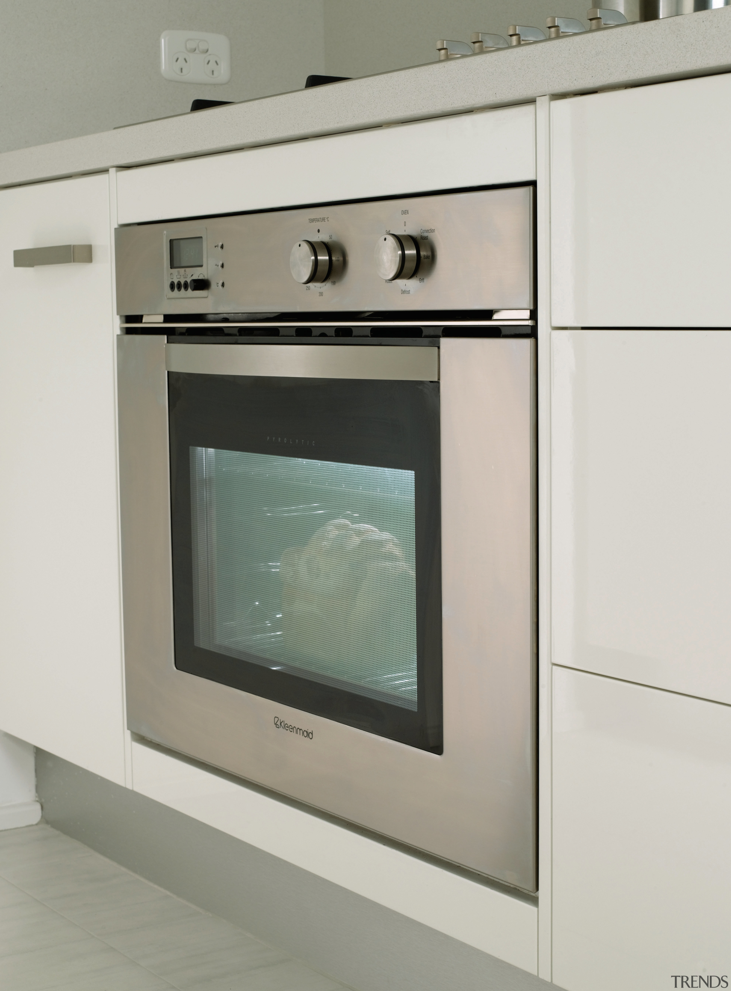 A view of a kitchen area, white cabinetry clothes dryer, gas stove, home appliance, kitchen appliance, kitchen stove, major appliance, microwave oven, oven, product design, gray, white