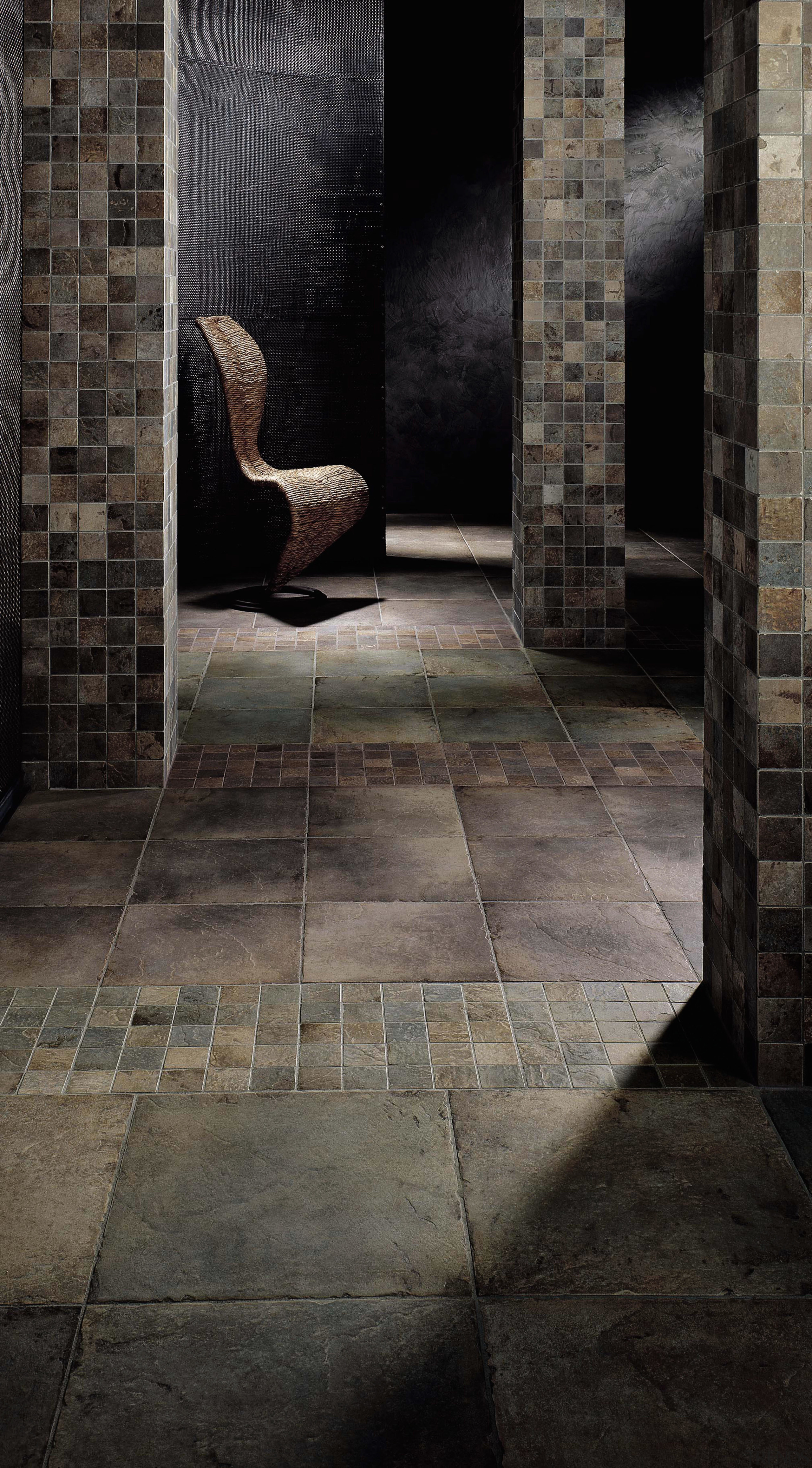 Area with coloured tiles and mosaic tiles, columns brick, concrete, floor, flooring, light, tile, wall, wood, black, gray