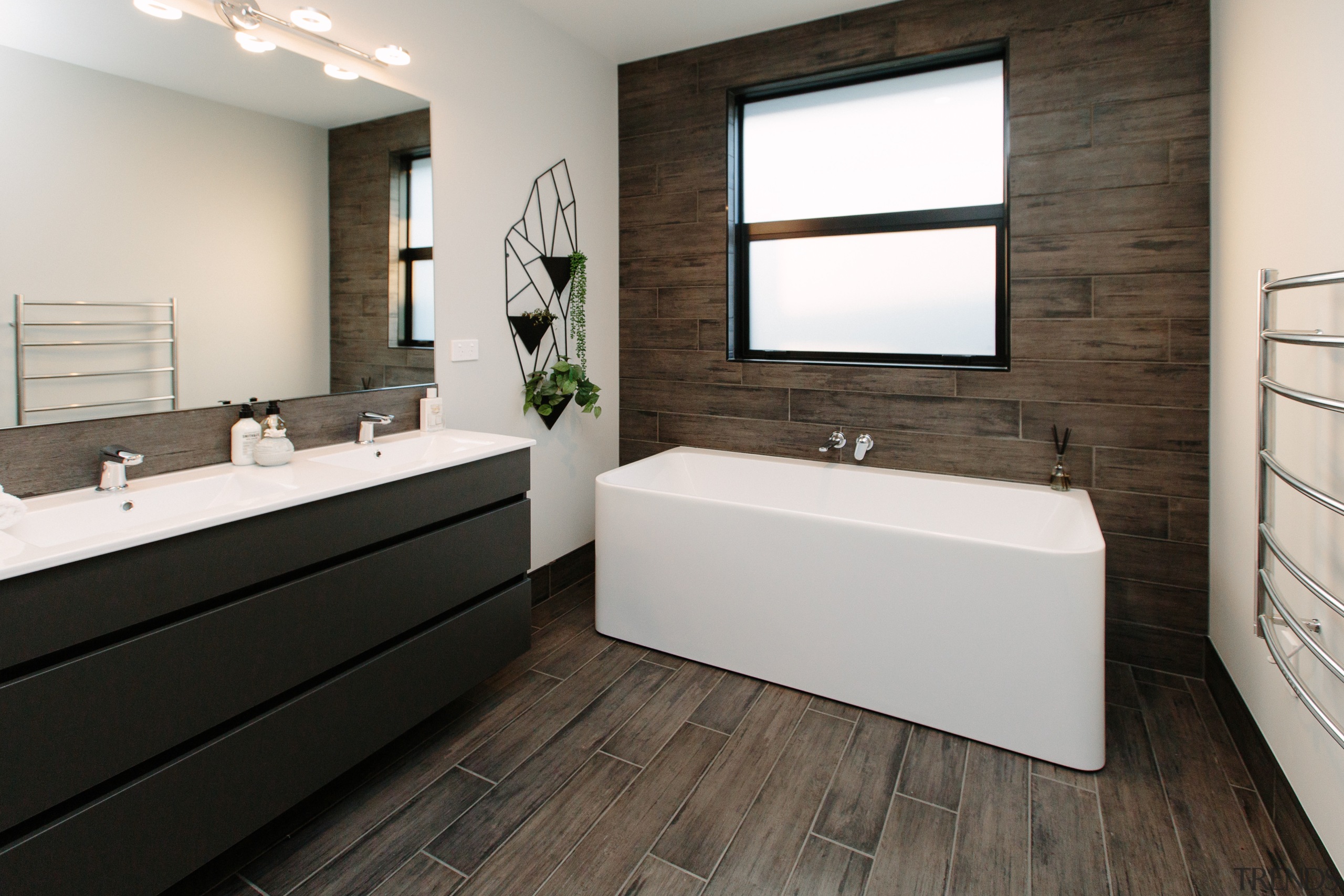 In this Sentinel Homes showhome, the designer bathroom bathroom, floor, interior design, product design, room, white, black