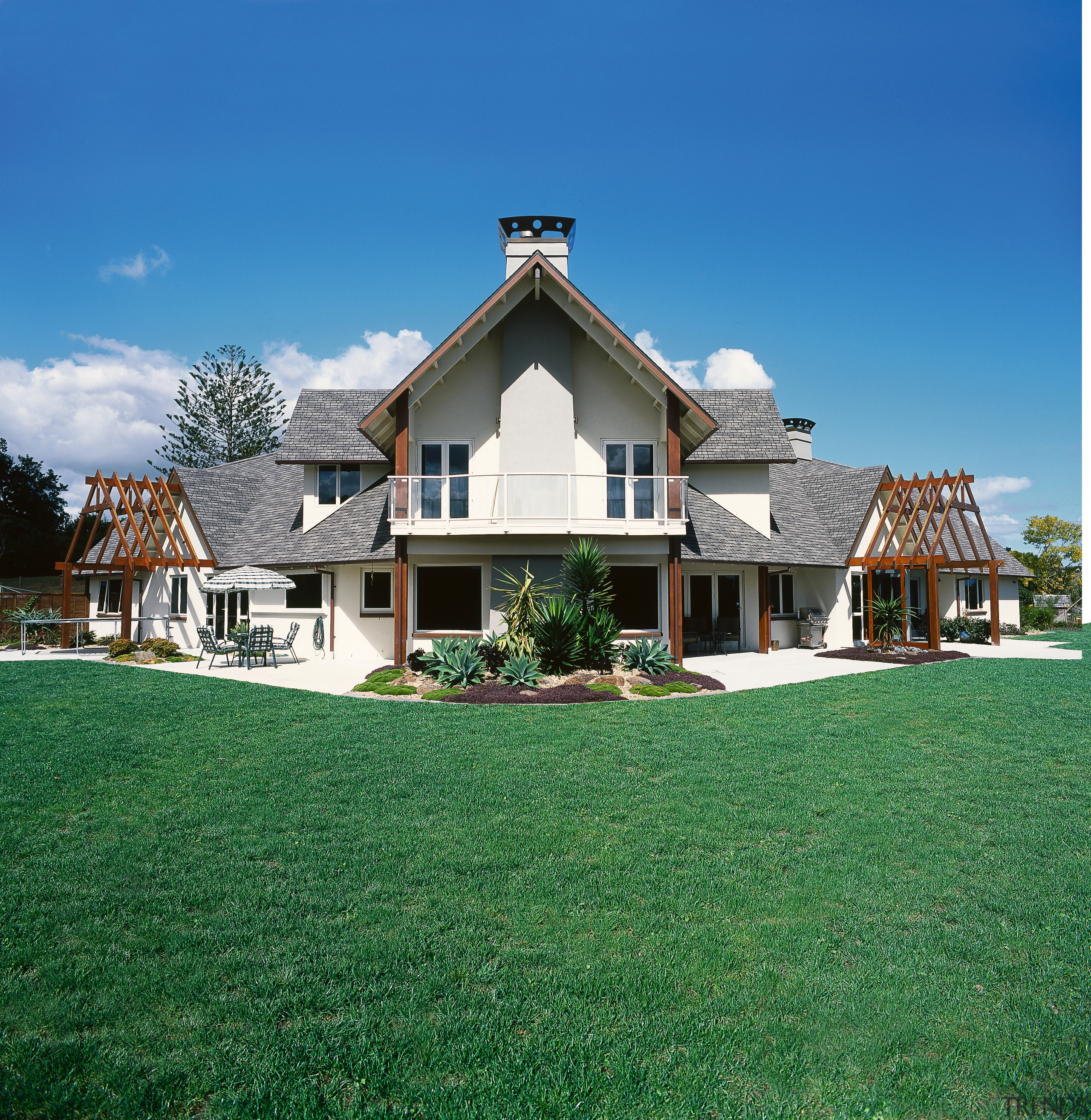 Exterior view of two storey home with shingle cottage, estate, facade, farmhouse, grass, home, house, lawn, mansion, property, real estate, residential area, roof, siding, sky, suburb, villa, window, green