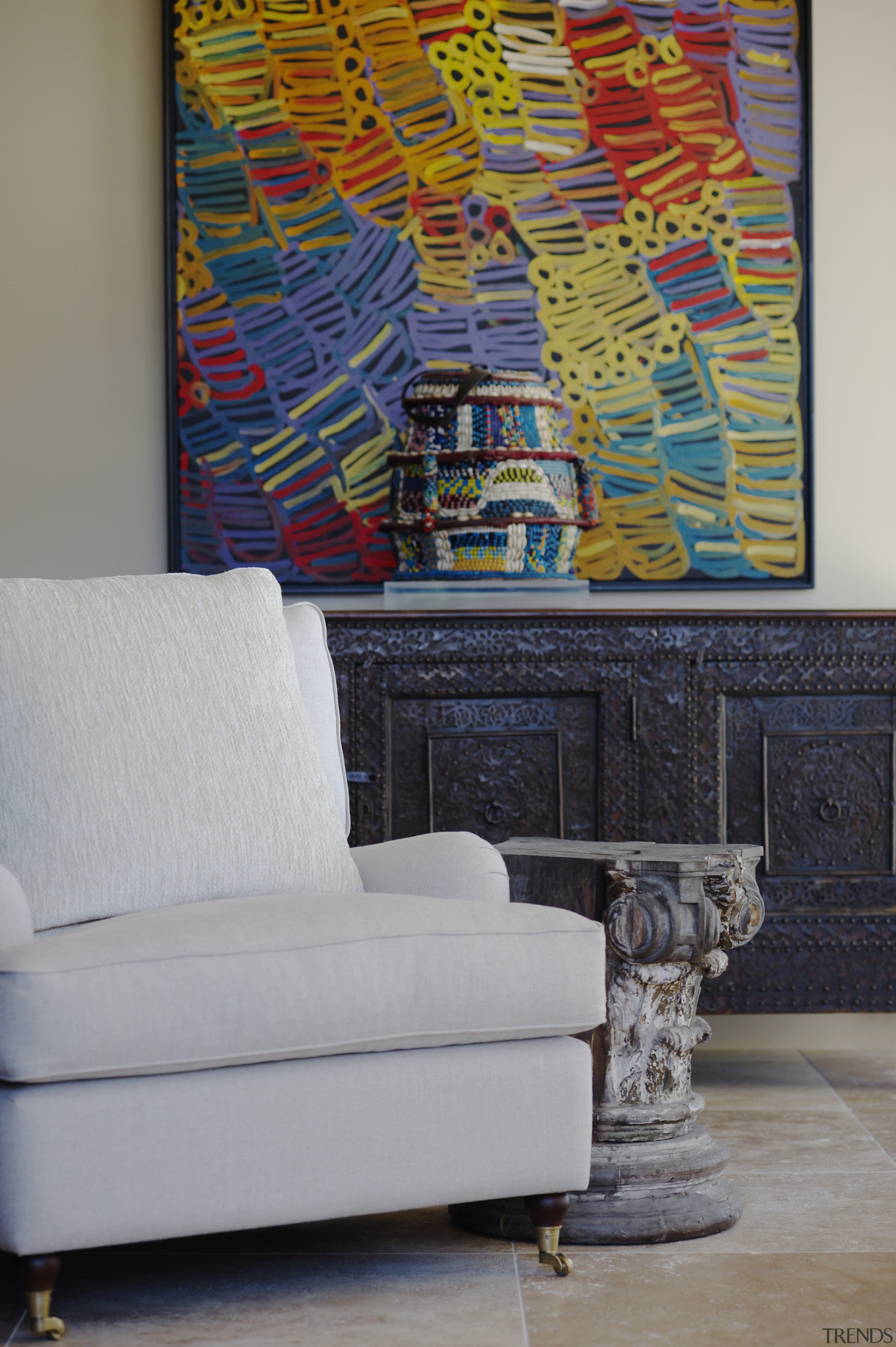 Eclectic interior by designer Garth Barnett with antique art, couch, furniture, interior design, living room, modern art, painting, table, wall, gray