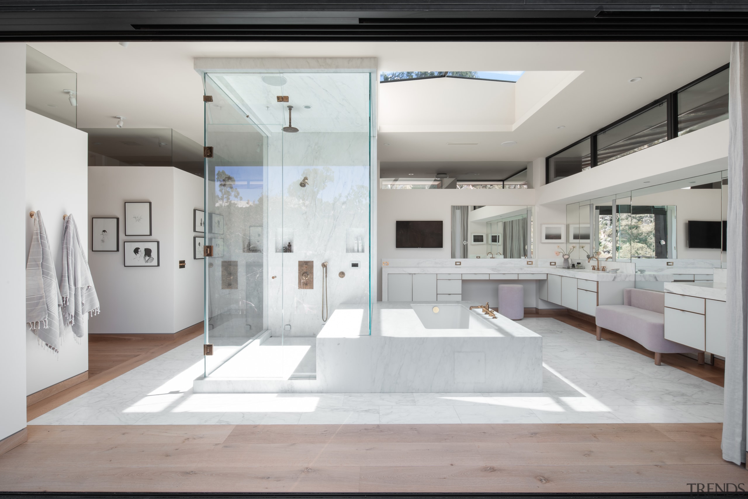 The expansive master bathroom features his and hers 