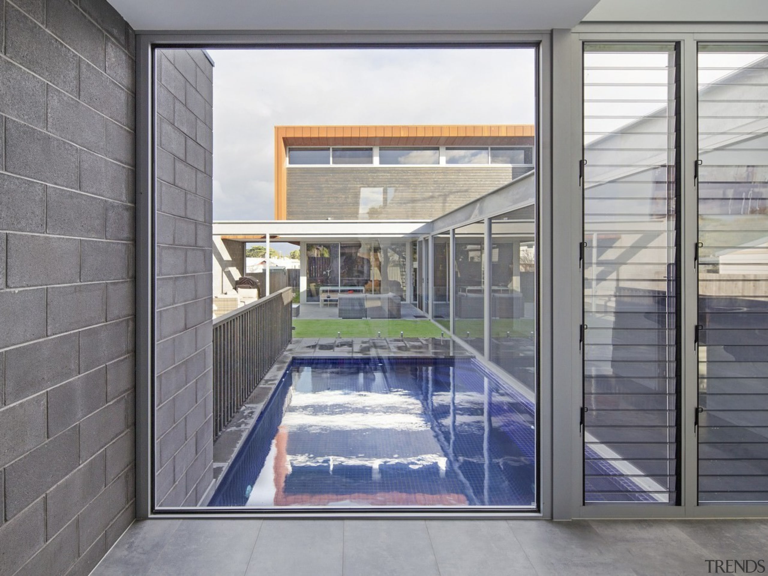 This hall window faces down onto the pool daylighting, door, glass, house, real estate, window, gray