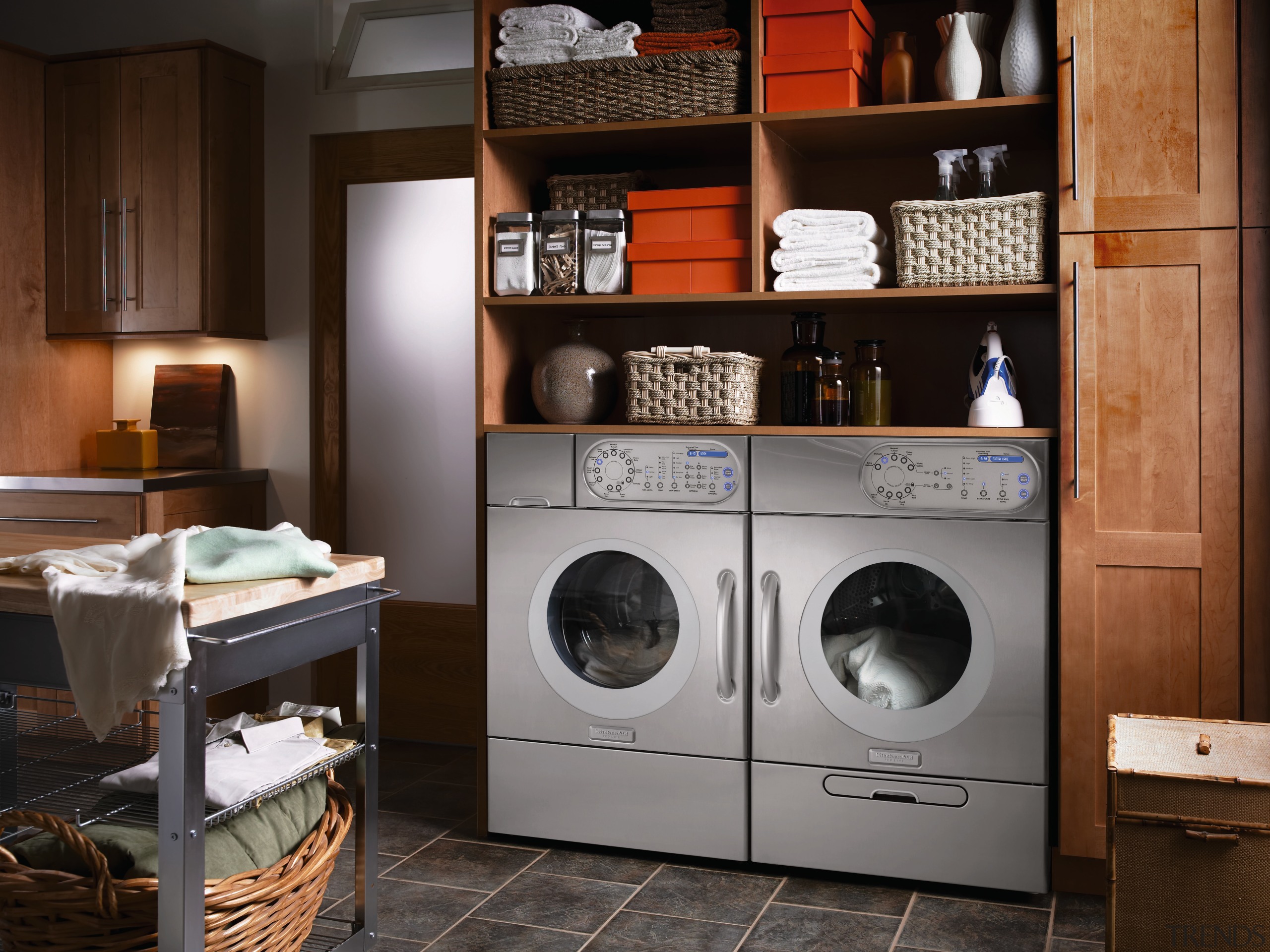 A view of this niche built in laundry cabinetry, clothes dryer, furniture, home appliance, laundry, laundry room, major appliance, room, washing machine, black, gray