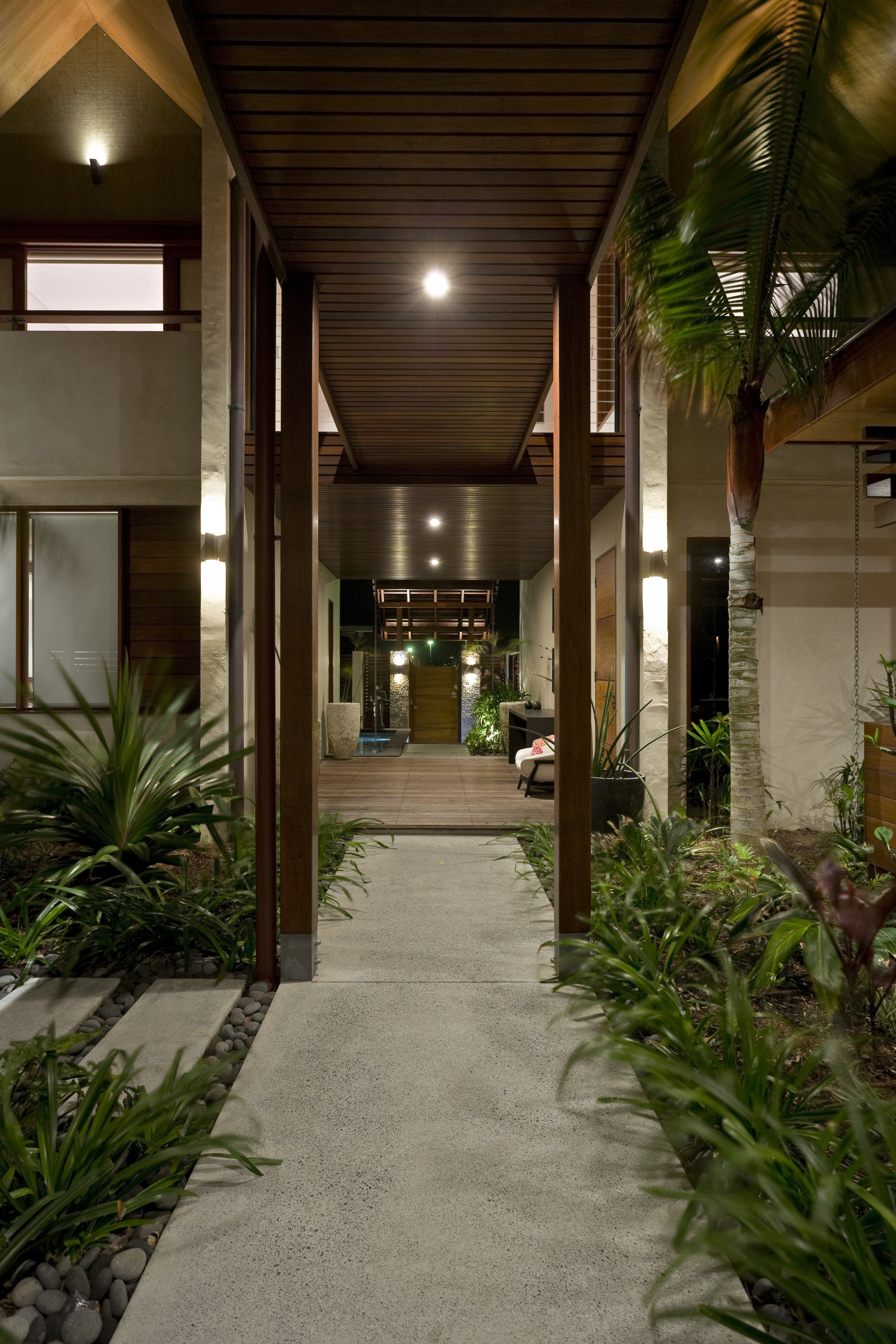 View of the covered breezeway which runs from condominium, courtyard, estate, home, house, lighting, real estate, walkway, brown