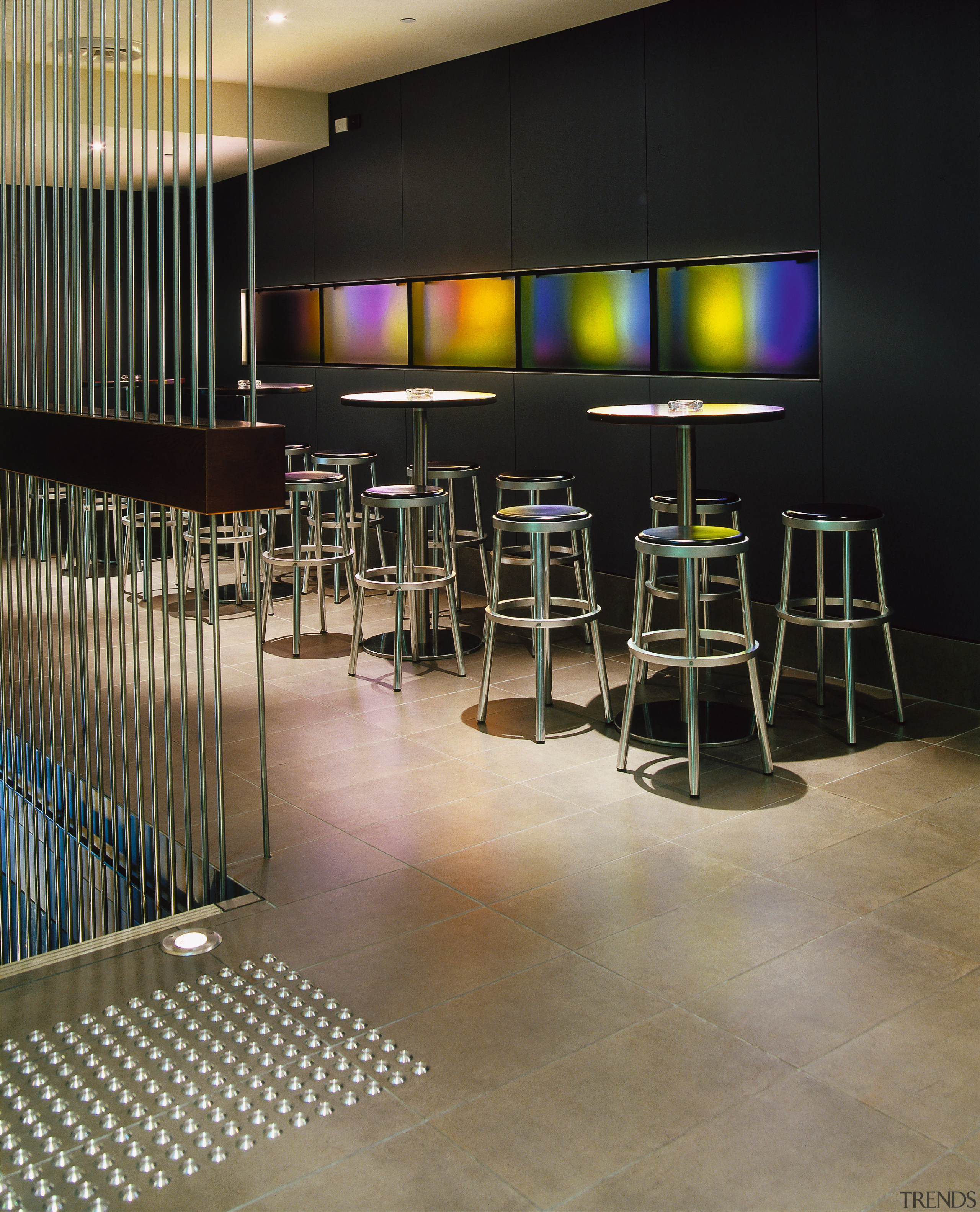 View of bar area with tiled flooring, bar floor, flooring, furniture, interior design, table, black, brown
