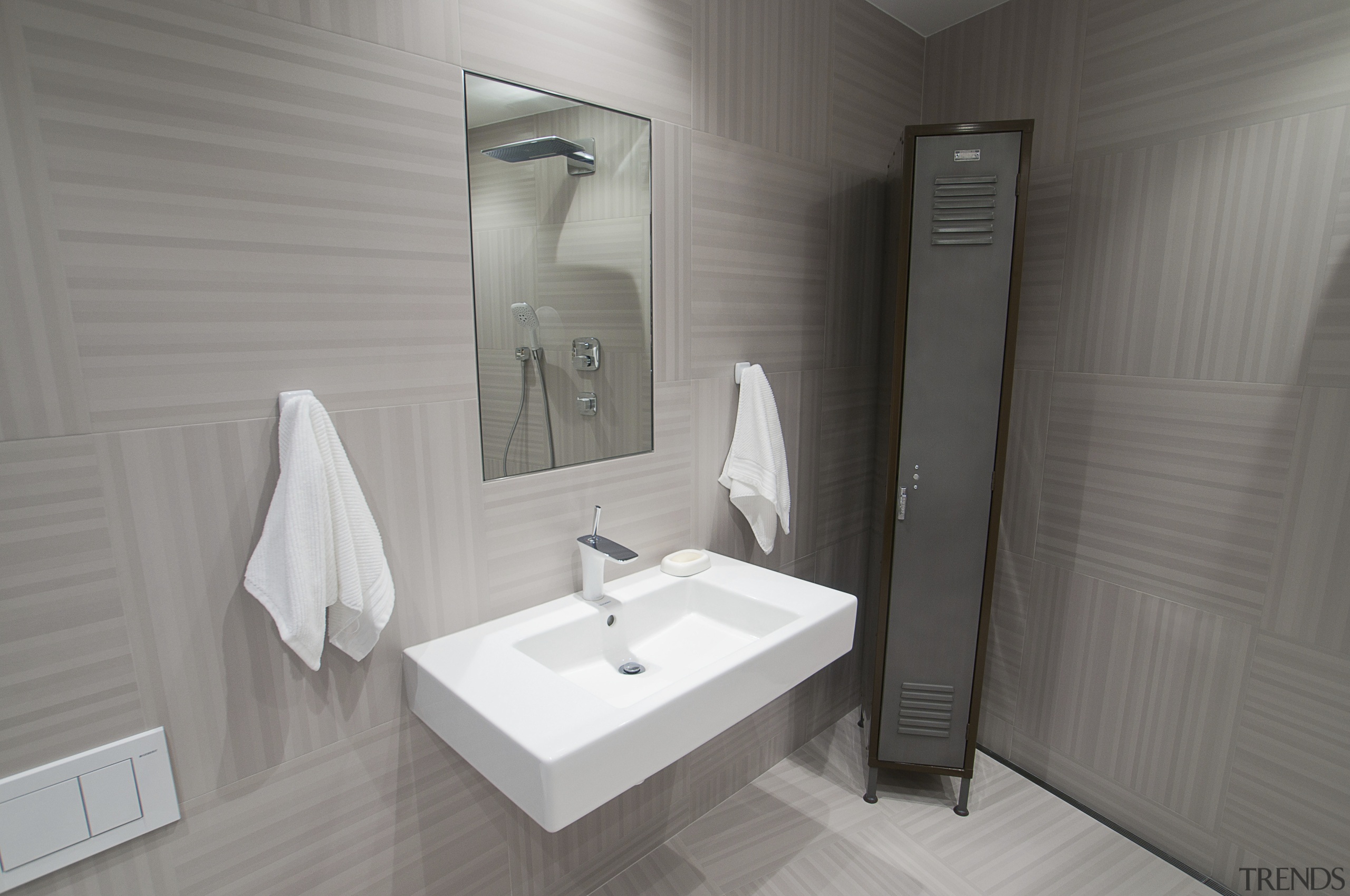 This bathroom was the winner of the small bathroom, floor, interior design, plumbing fixture, product design, room, sink, gray