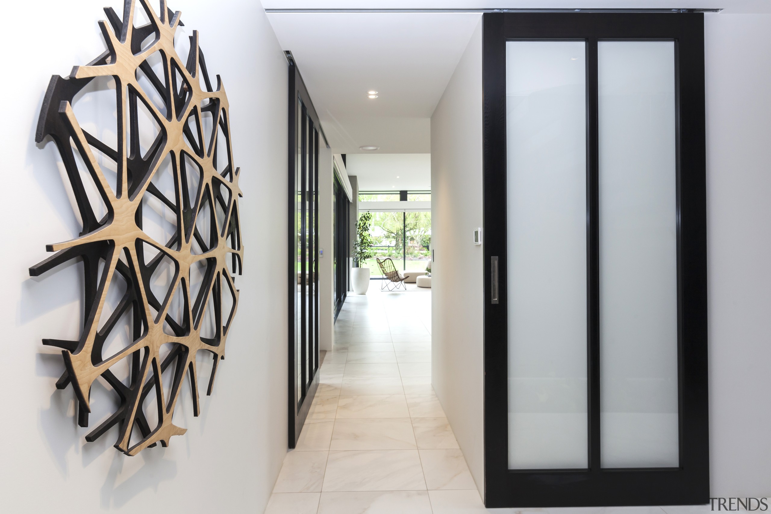 The entry to this home features serene shoji-like, architecture, door, interior design, entrance, shoji doors, wall sculpture, Don Service, O'Neil Architecture