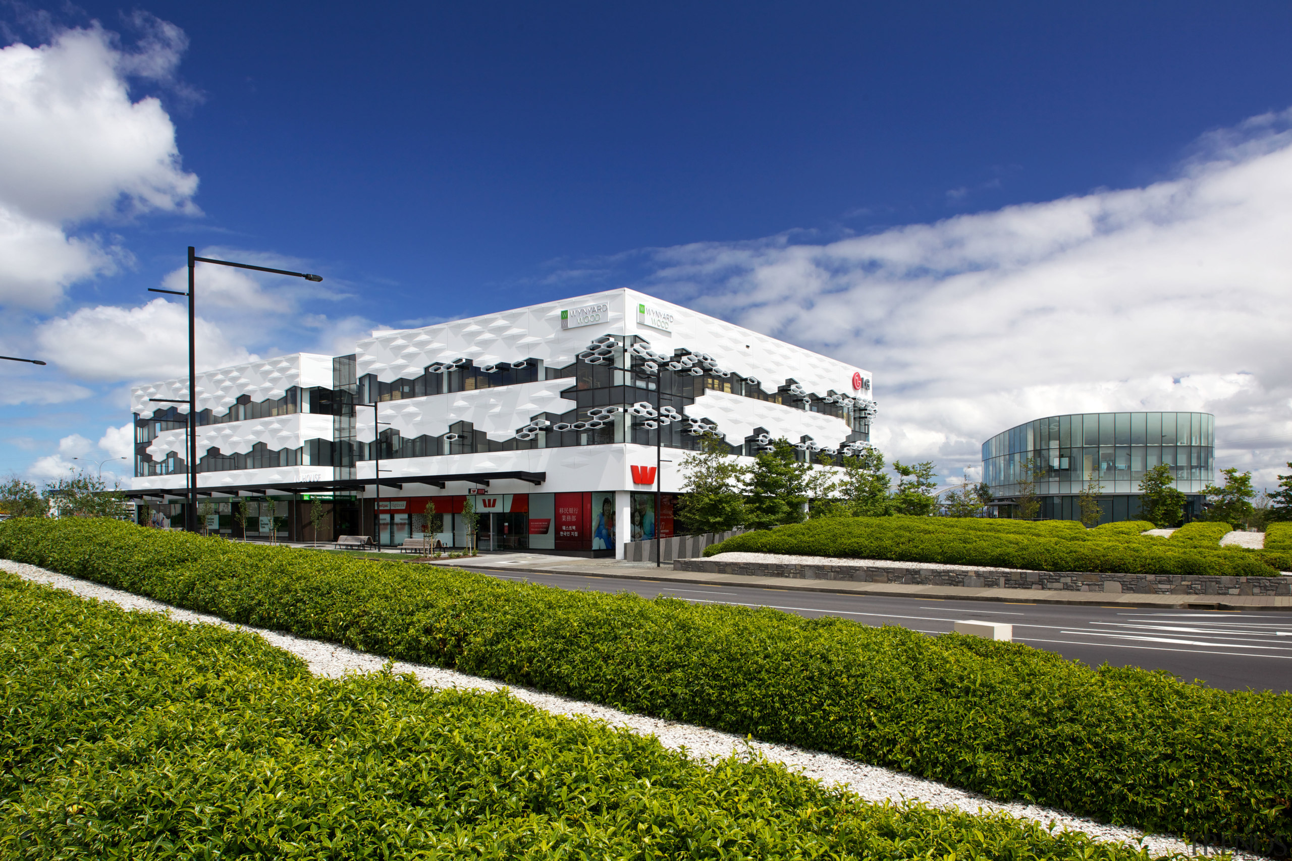 The Crossing at Highbrook Business Park was constructed architecture, building, corporate headquarters, headquarters, metropolitan area, mixed use, real estate, sky, structure, blue, brown