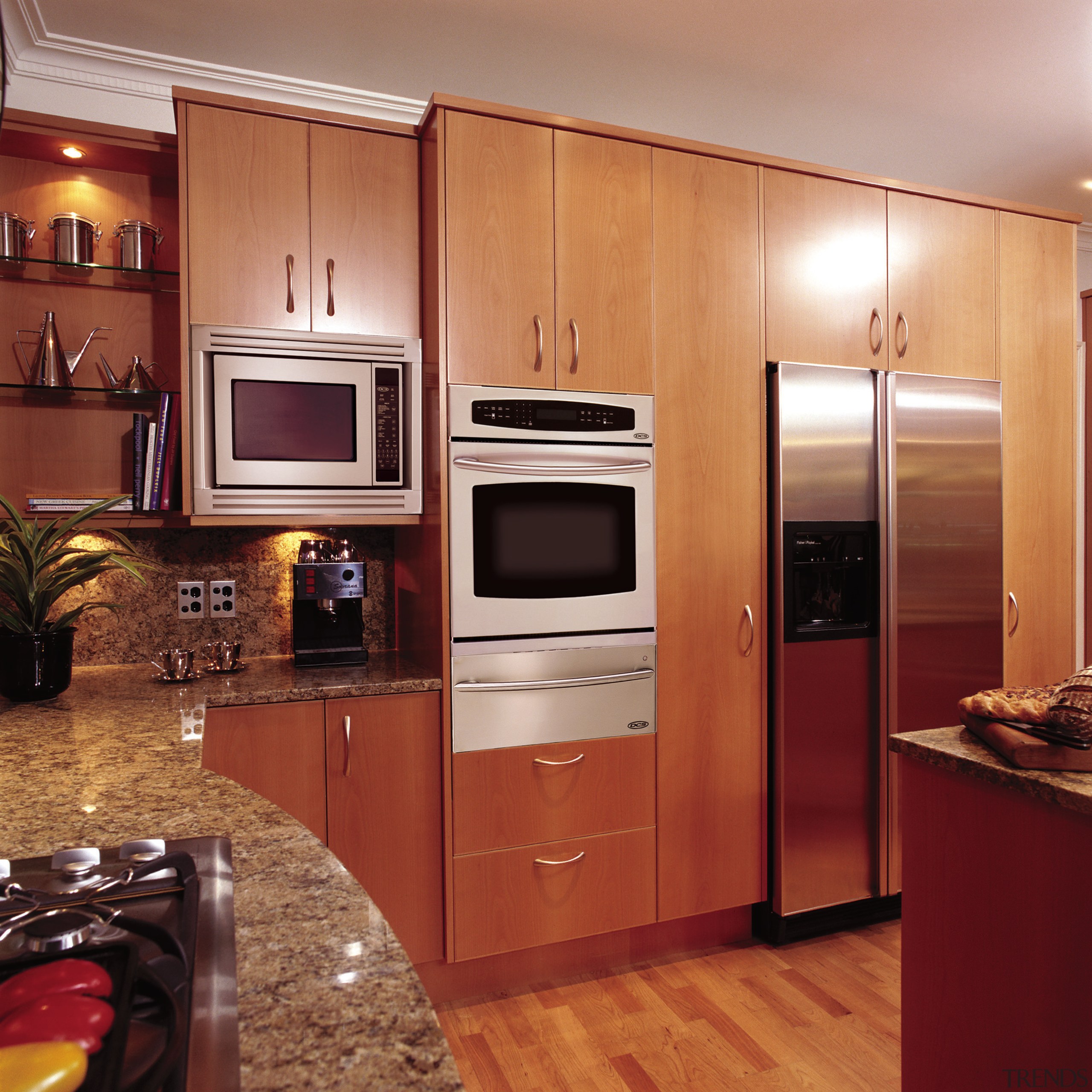 View of a kitchen, wooden flooring and cabinetry, cabinetry, countertop, cuisine classique, flooring, hardwood, home appliance, interior design, kitchen, room, under cabinet lighting, wood flooring, red, orange