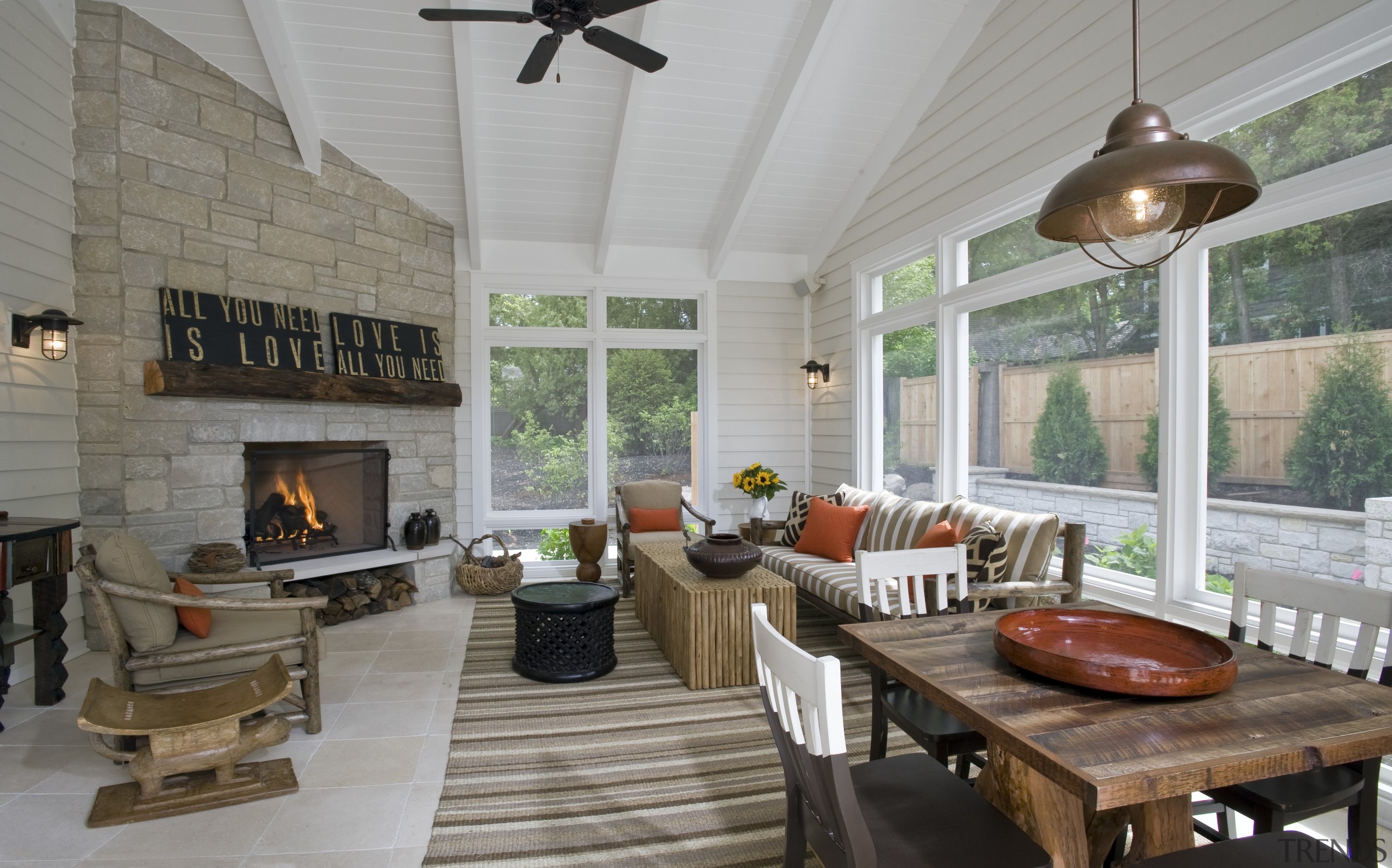 View of open plan dining and lounge area hearth, interior design, living room, outdoor structure, patio, porch, real estate, gray