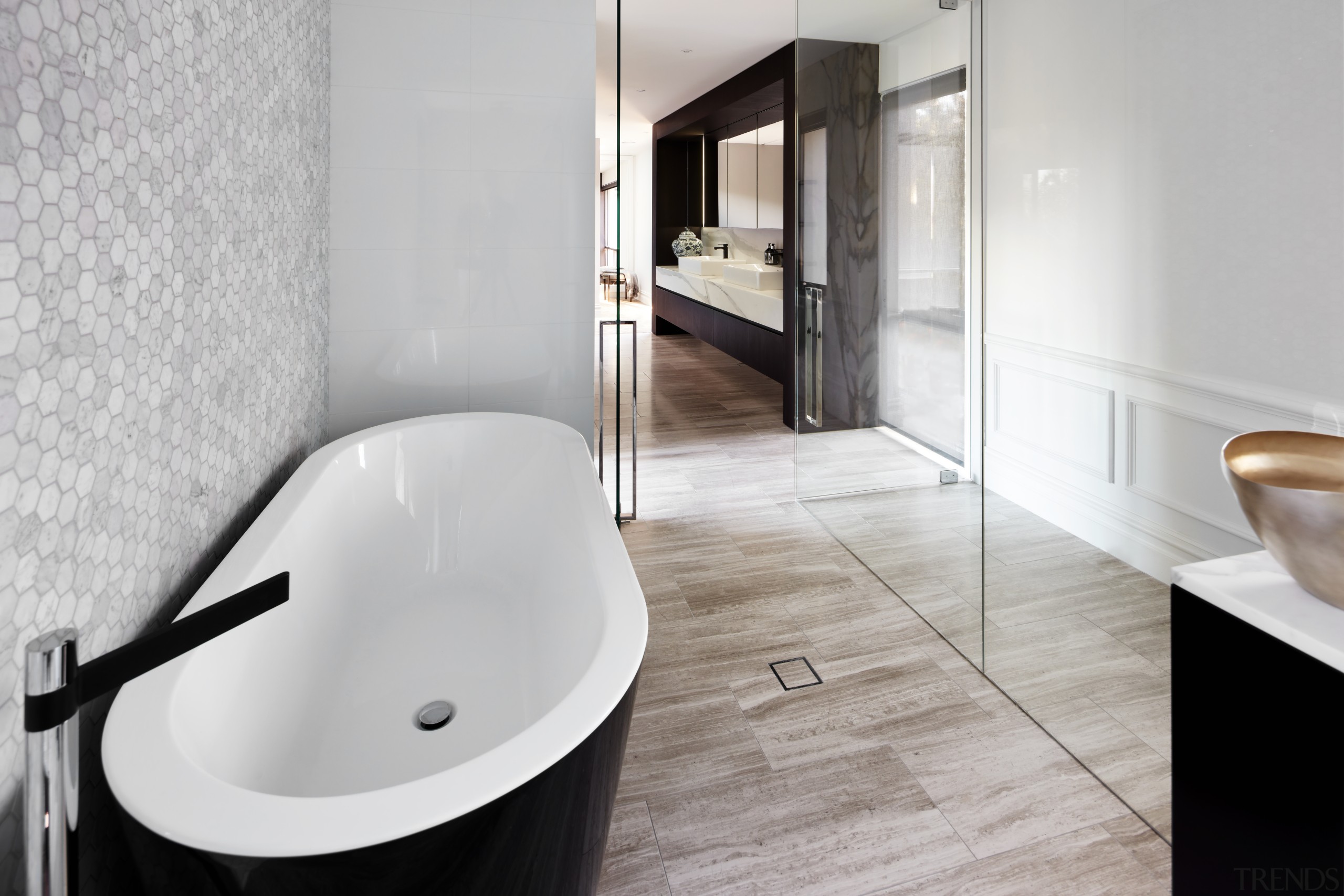 ​​​​​​​This long bathroom combines classic surfaces such as architecture, bathroom, bathtub, bidet, ceramic, plumbing fixture, property, tap, moasaic tile, toilet, Archer Design