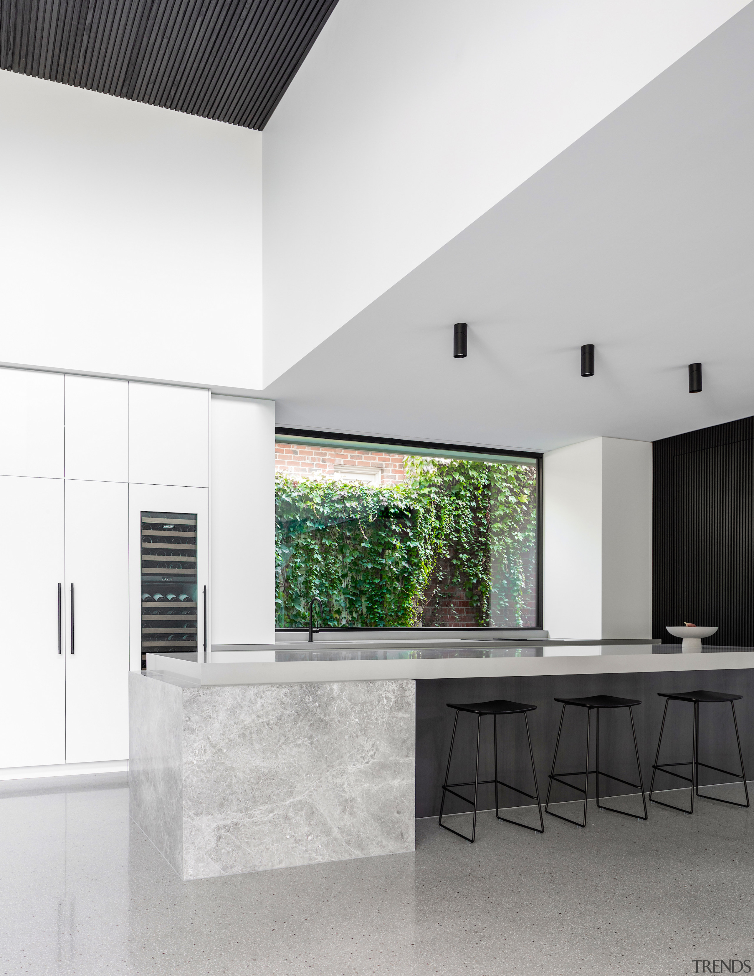 Kitchen complete with window splashback and double-height void 