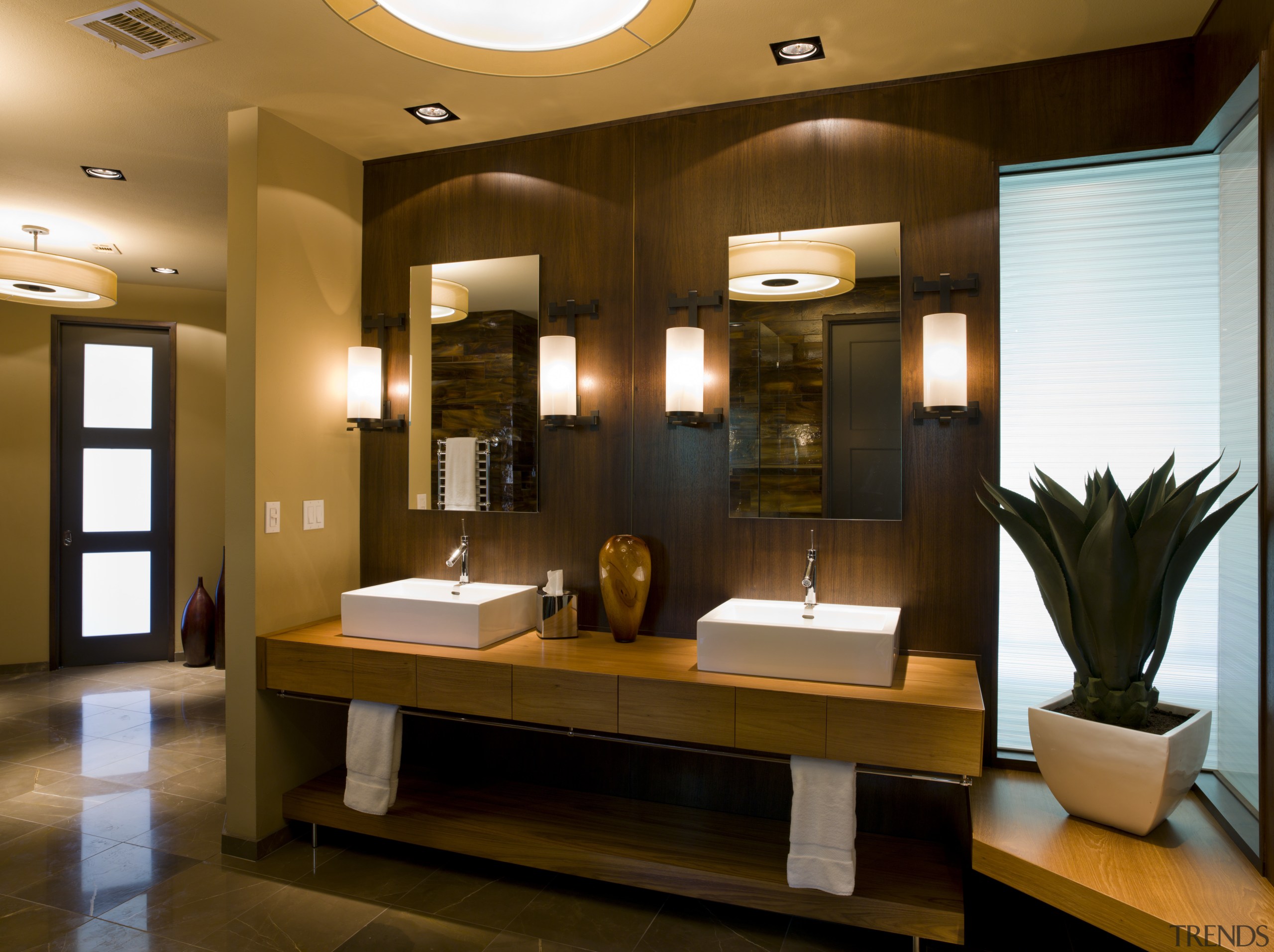 Walnut paneling in this bathroom matches the walls ceiling, interior design, lobby, room, brown