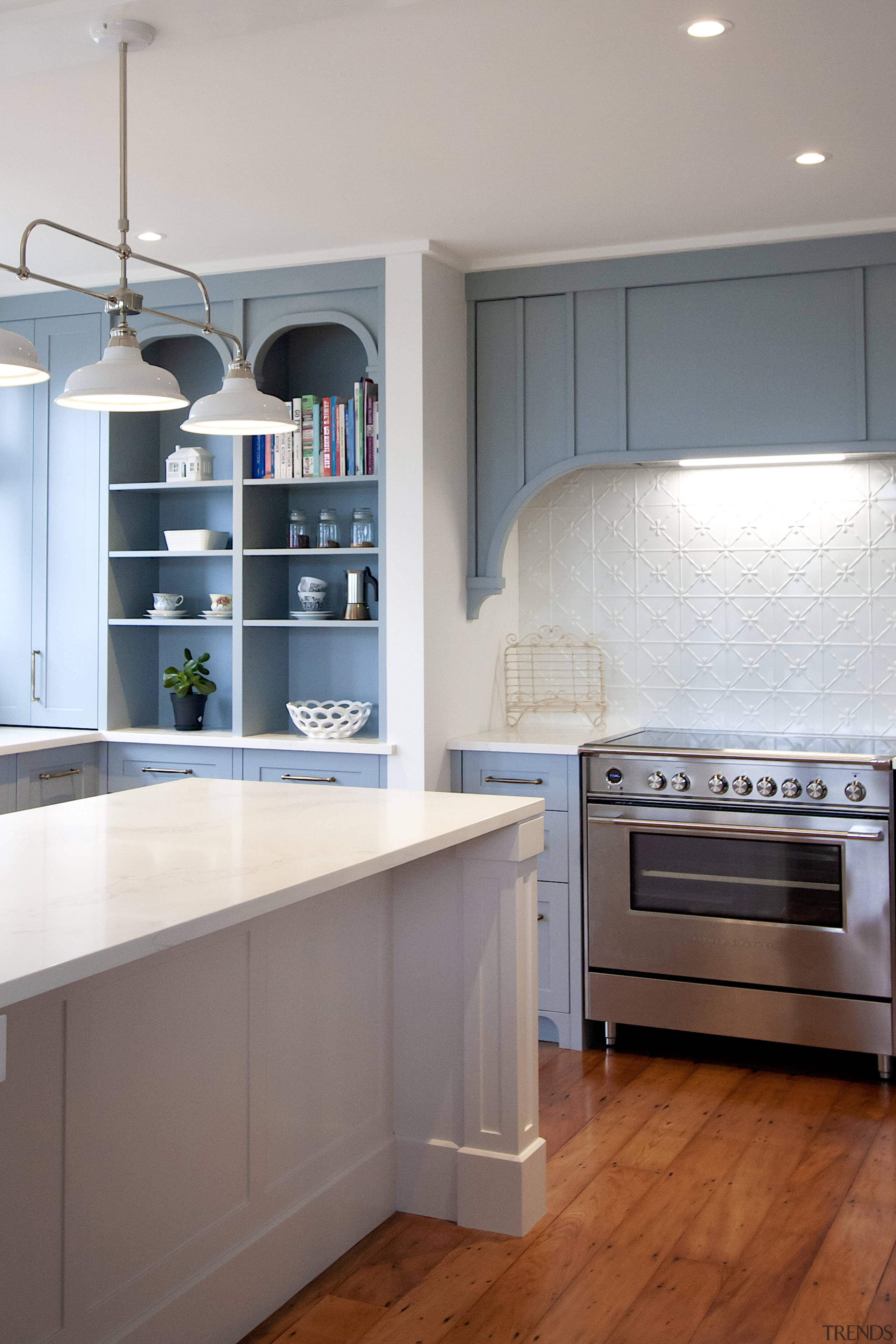 Storage is also incorporated into the classic-look rangehood. 