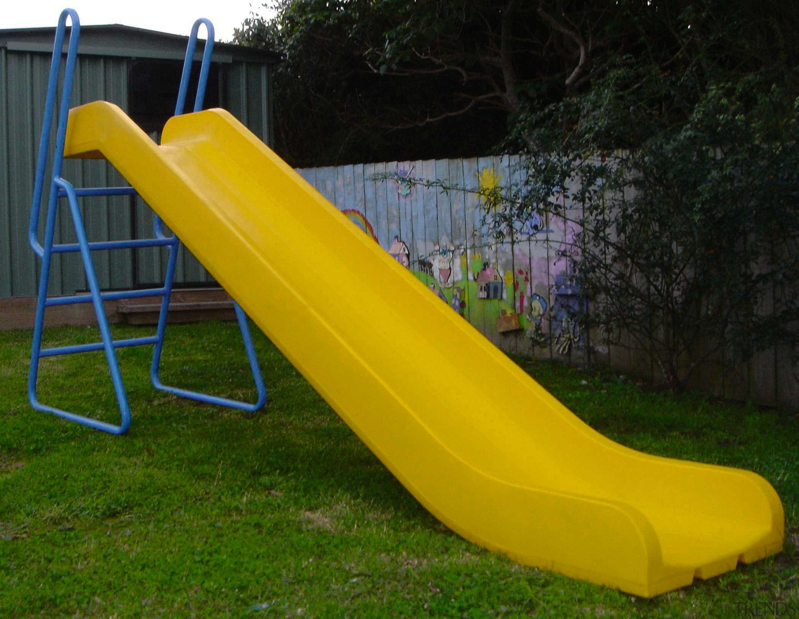 Bright yellow play slide with blue ladder. - chute, leisure, outdoor furniture, outdoor play equipment, playground slide, yellow, black, brown