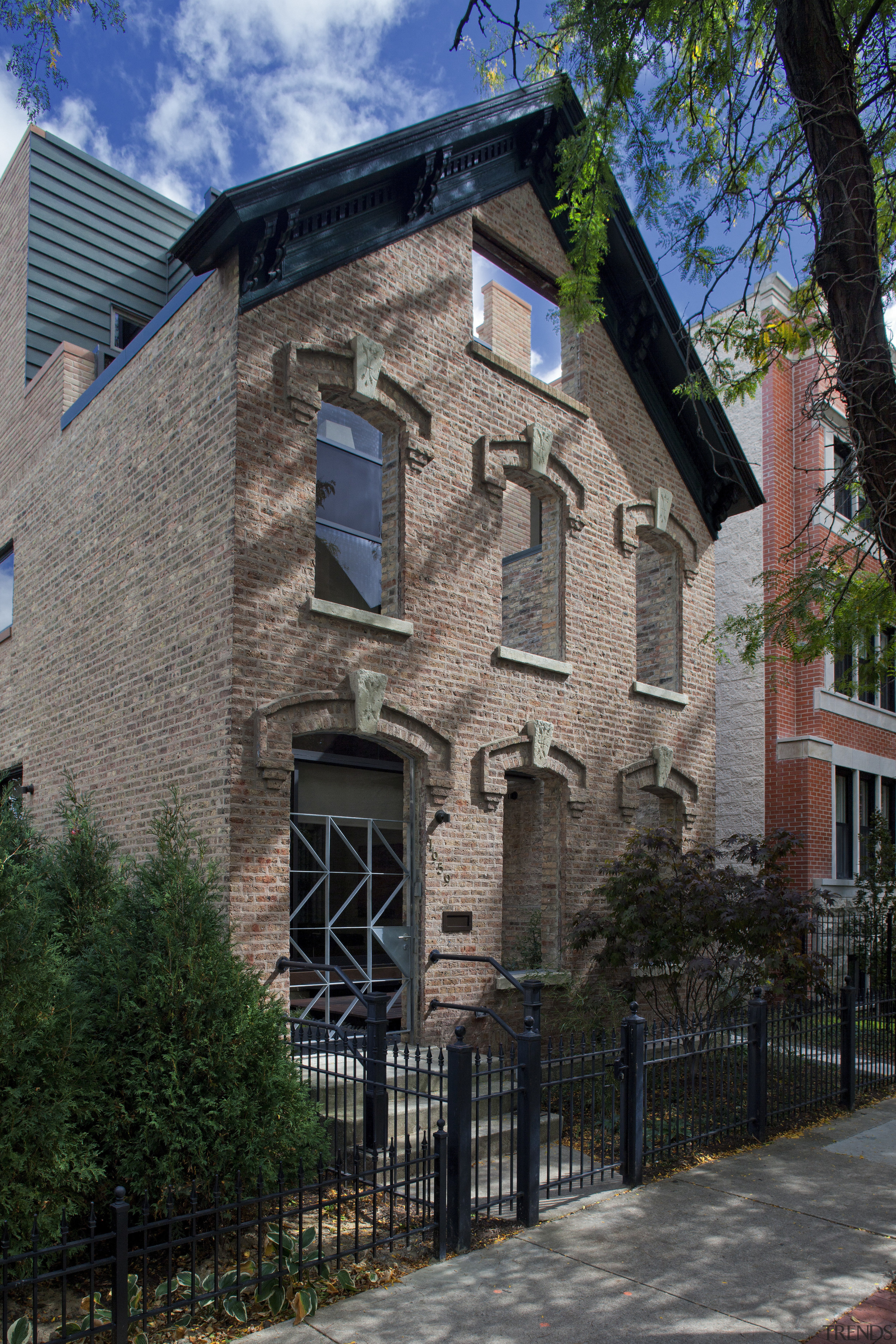 View of a renovated three-story home, built to apartment, architecture, building, city, cottage, estate, facade, historic house, home, house, landmark, mansion, neighbourhood, property, real estate, residential area, tree, window, black, gray