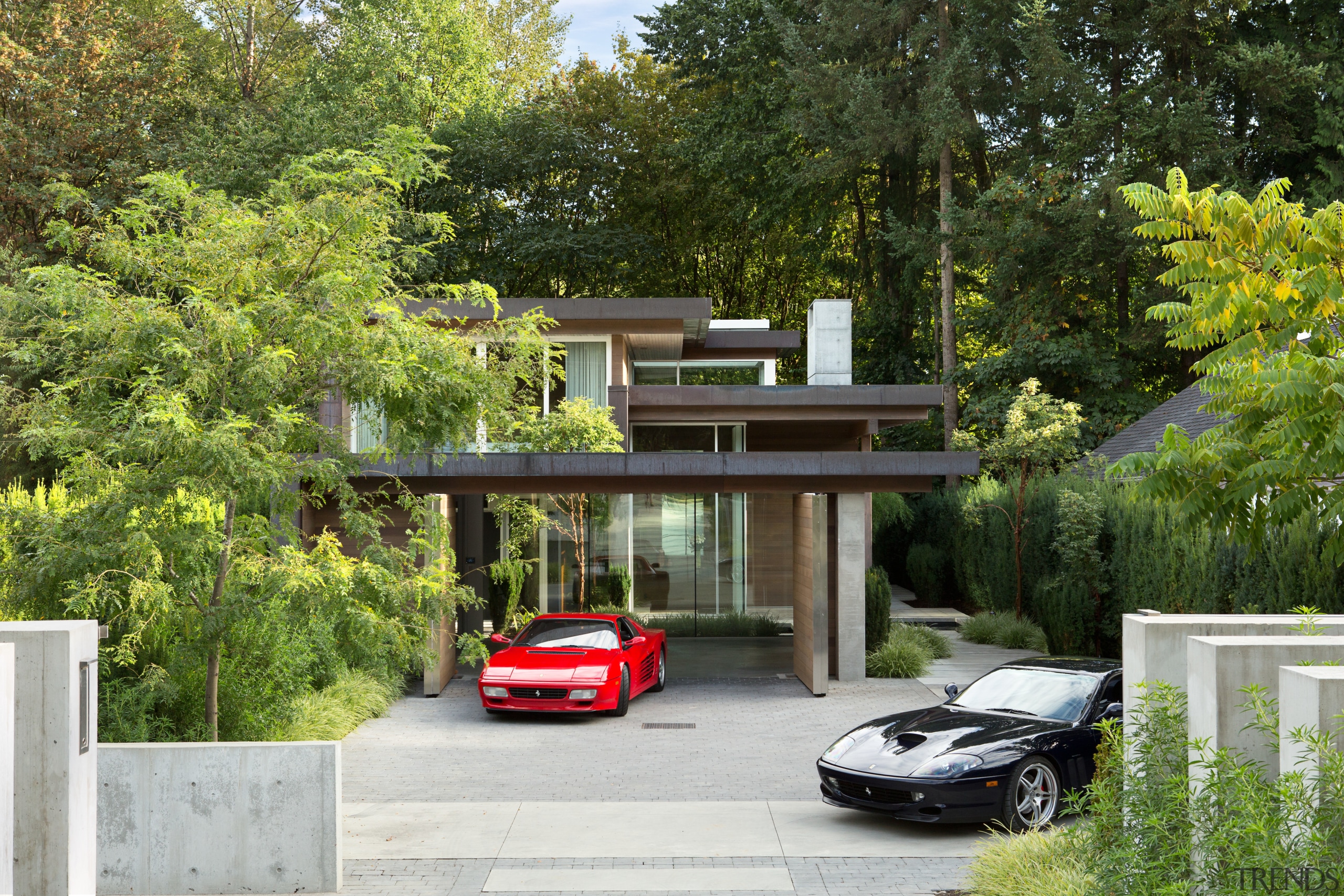 Having a long narrow site with forest surrounds architecture, automotive exterior, car, family car, home, house, luxury vehicle, neighbourhood, outdoor structure, plant, property, real estate, residential area, suburb, tree, brown